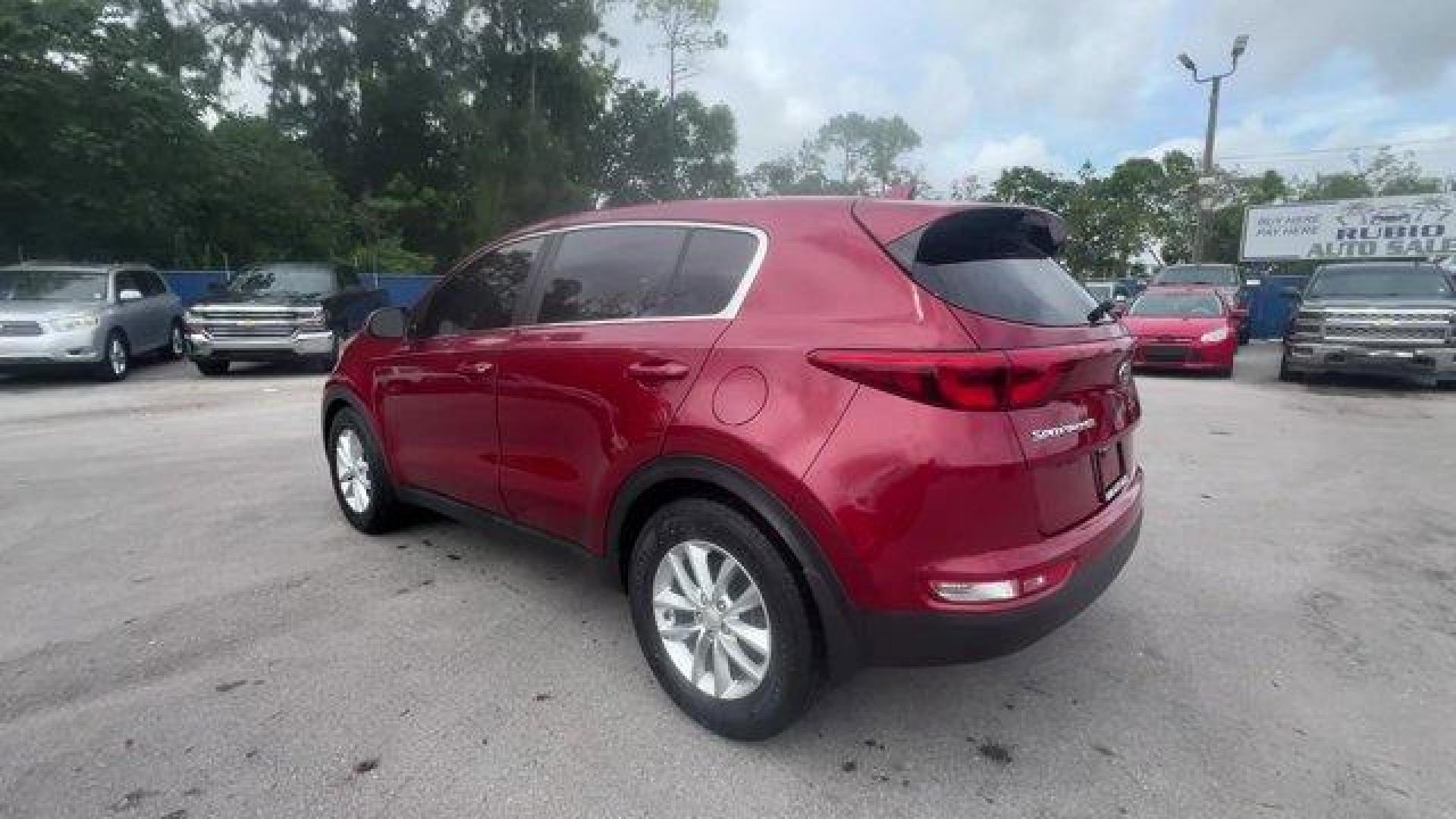 2017 Hyper Red /Black Kia Sportage (KNDPM3AC6H7) with an 4 2.4 L engine, Automatic transmission, located at 27610 S Dixie Hwy, Homestead, FL, 33032, (305) 749-2348, 25.510241, -80.438301 - IIHS Top Safety Pick, Top Safety Pick+. Delivers 30 Highway MPG and 23 City MPG! This Kia Sportage boasts a Regular Unleaded I-4 2.4 L/144 engine powering this Automatic transmission. WHEEL LOCKS, HYPER RED, CARPET FLOOR MATS.* This Kia Sportage Features the Following Options *BLACK, CLOTH SEAT TRIM - Photo#2