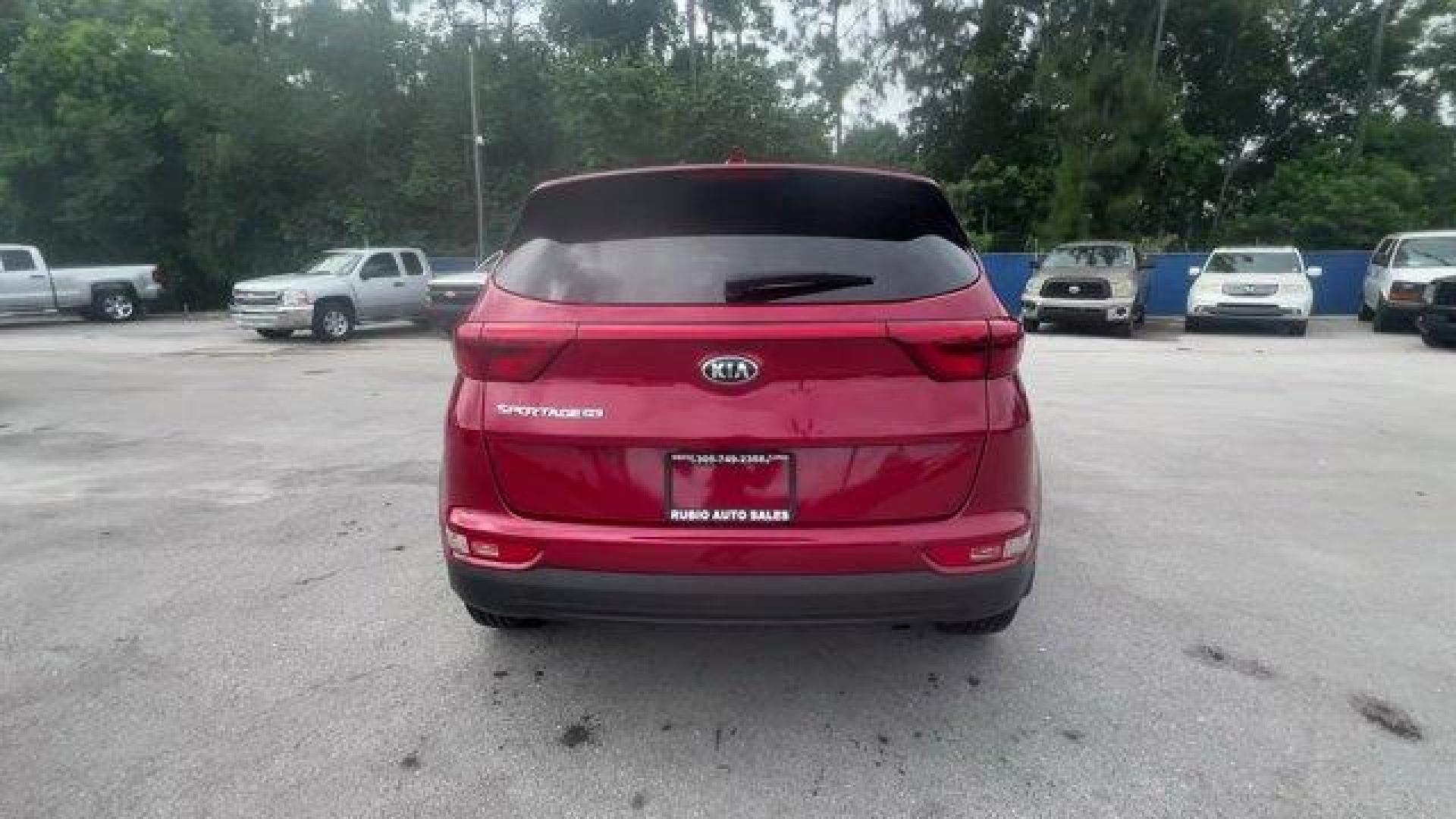 2017 Hyper Red /Black Kia Sportage (KNDPM3AC6H7) with an 4 2.4 L engine, Automatic transmission, located at 27610 S Dixie Hwy, Homestead, FL, 33032, (305) 749-2348, 25.510241, -80.438301 - IIHS Top Safety Pick, Top Safety Pick+. Delivers 30 Highway MPG and 23 City MPG! This Kia Sportage boasts a Regular Unleaded I-4 2.4 L/144 engine powering this Automatic transmission. WHEEL LOCKS, HYPER RED, CARPET FLOOR MATS.* This Kia Sportage Features the Following Options *BLACK, CLOTH SEAT TRIM - Photo#3