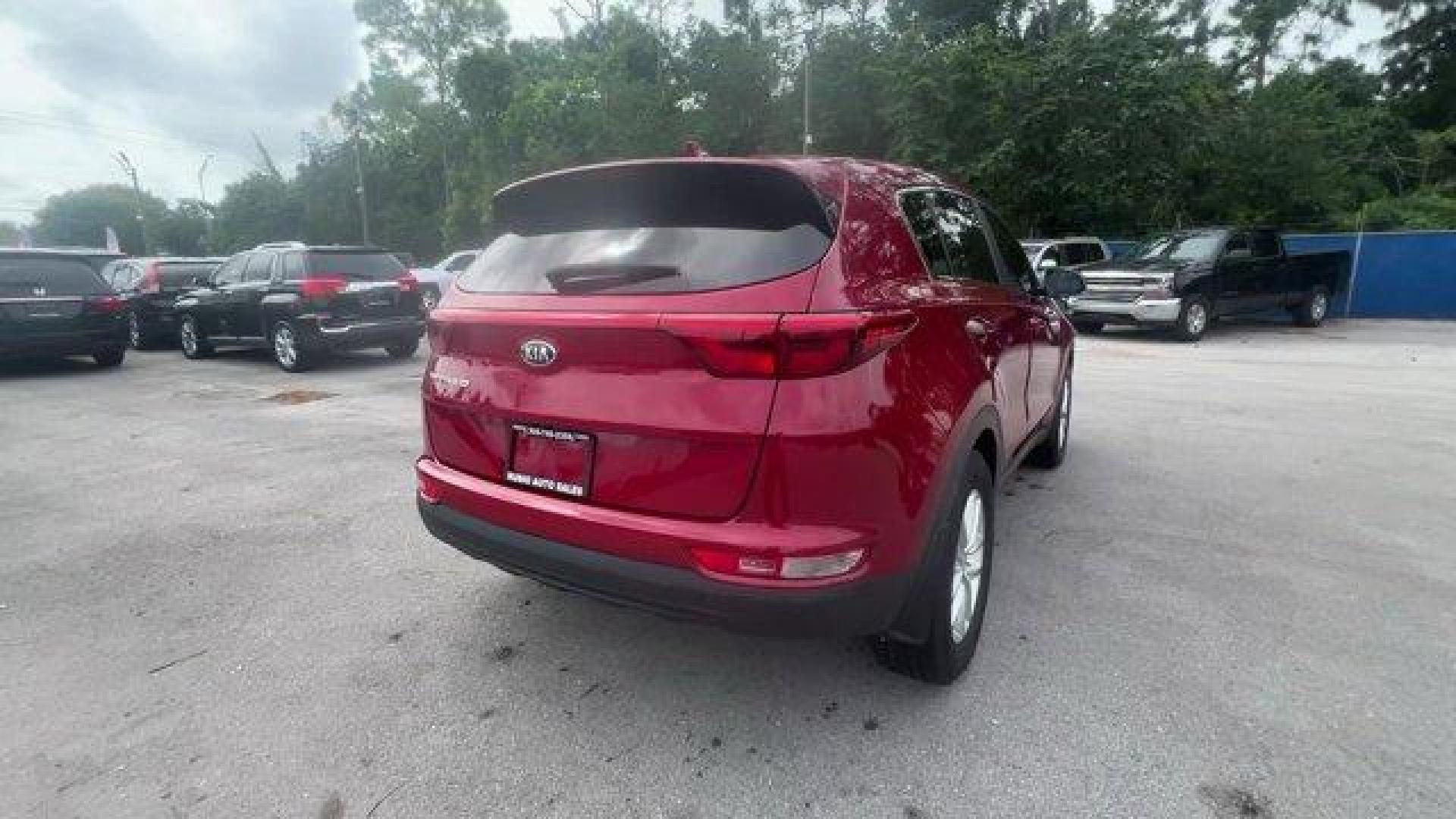 2017 Hyper Red /Black Kia Sportage (KNDPM3AC6H7) with an 4 2.4 L engine, Automatic transmission, located at 27610 S Dixie Hwy, Homestead, FL, 33032, (305) 749-2348, 25.510241, -80.438301 - IIHS Top Safety Pick, Top Safety Pick+. Delivers 30 Highway MPG and 23 City MPG! This Kia Sportage boasts a Regular Unleaded I-4 2.4 L/144 engine powering this Automatic transmission. WHEEL LOCKS, HYPER RED, CARPET FLOOR MATS.* This Kia Sportage Features the Following Options *BLACK, CLOTH SEAT TRIM - Photo#4