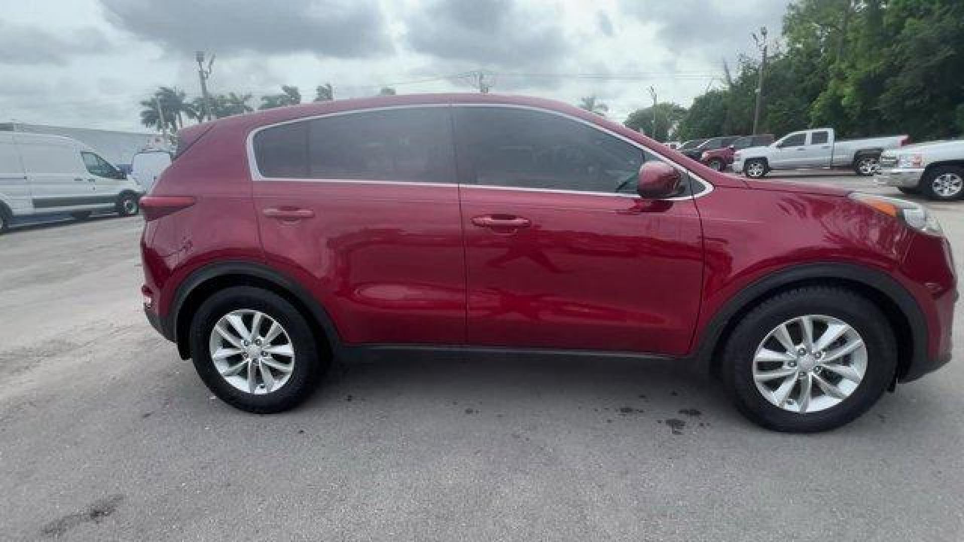 2017 Hyper Red /Black Kia Sportage (KNDPM3AC6H7) with an 4 2.4 L engine, Automatic transmission, located at 27610 S Dixie Hwy, Homestead, FL, 33032, (305) 749-2348, 25.510241, -80.438301 - IIHS Top Safety Pick, Top Safety Pick+. Delivers 30 Highway MPG and 23 City MPG! This Kia Sportage boasts a Regular Unleaded I-4 2.4 L/144 engine powering this Automatic transmission. WHEEL LOCKS, HYPER RED, CARPET FLOOR MATS.* This Kia Sportage Features the Following Options *BLACK, CLOTH SEAT TRIM - Photo#5