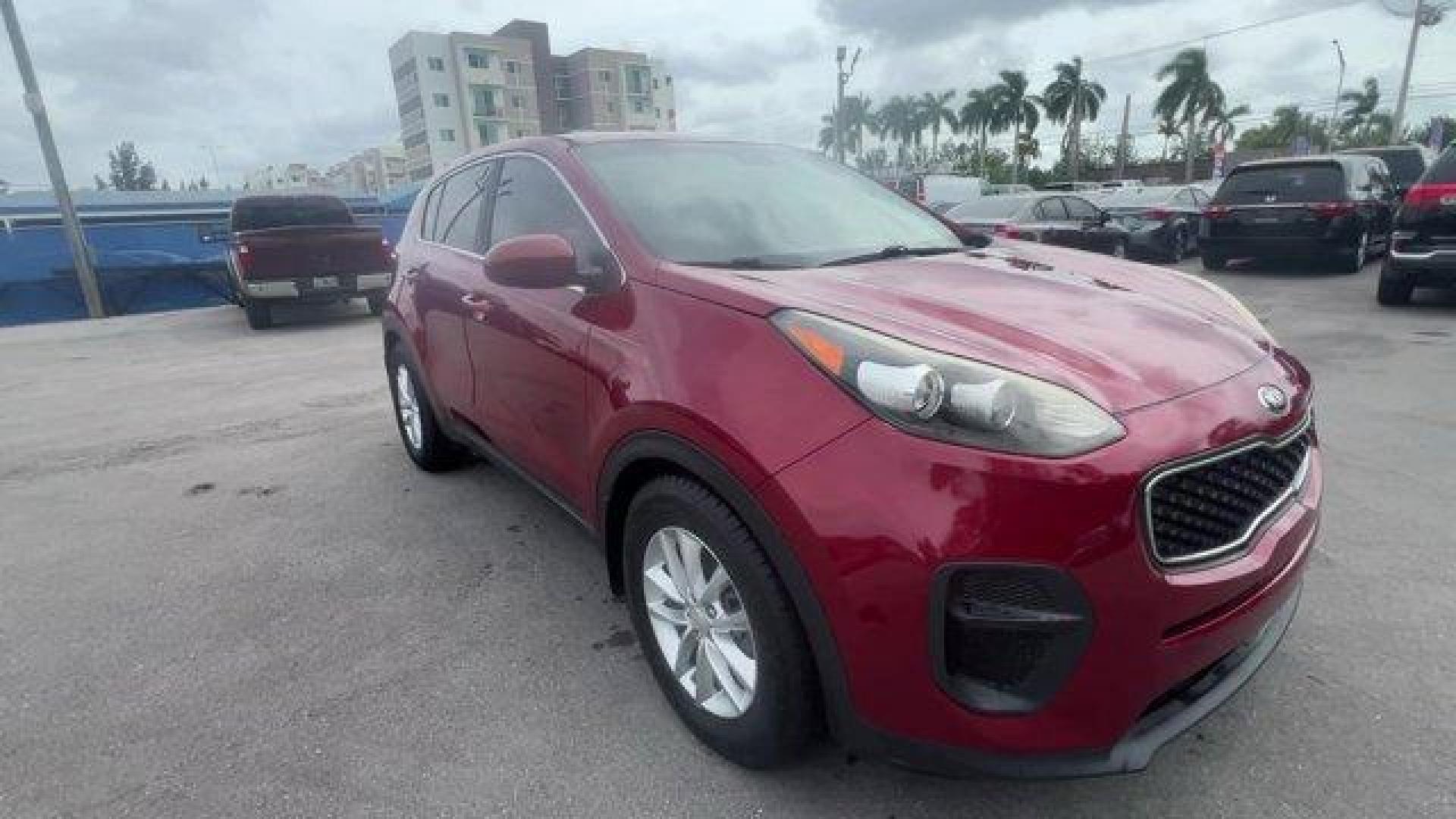 2017 Hyper Red /Black Kia Sportage (KNDPM3AC6H7) with an 4 2.4 L engine, Automatic transmission, located at 27610 S Dixie Hwy, Homestead, FL, 33032, (305) 749-2348, 25.510241, -80.438301 - IIHS Top Safety Pick, Top Safety Pick+. Delivers 30 Highway MPG and 23 City MPG! This Kia Sportage boasts a Regular Unleaded I-4 2.4 L/144 engine powering this Automatic transmission. WHEEL LOCKS, HYPER RED, CARPET FLOOR MATS.* This Kia Sportage Features the Following Options *BLACK, CLOTH SEAT TRIM - Photo#6