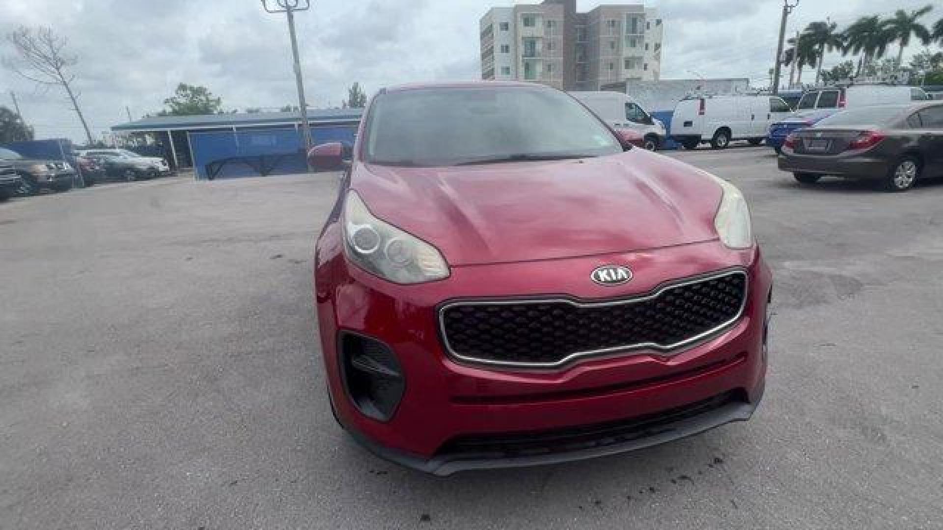 2017 Hyper Red /Black Kia Sportage (KNDPM3AC6H7) with an 4 2.4 L engine, Automatic transmission, located at 27610 S Dixie Hwy, Homestead, FL, 33032, (305) 749-2348, 25.510241, -80.438301 - IIHS Top Safety Pick, Top Safety Pick+. Delivers 30 Highway MPG and 23 City MPG! This Kia Sportage boasts a Regular Unleaded I-4 2.4 L/144 engine powering this Automatic transmission. WHEEL LOCKS, HYPER RED, CARPET FLOOR MATS.* This Kia Sportage Features the Following Options *BLACK, CLOTH SEAT TRIM - Photo#7