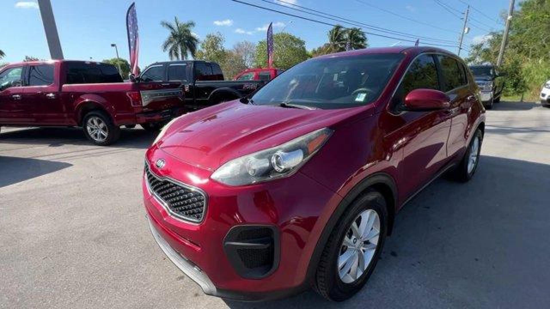 2017 Hyper Red /Black Kia Sportage (KNDPM3AC6H7) with an 4 2.4 L engine, Automatic transmission, located at 27610 S Dixie Hwy, Homestead, FL, 33032, (305) 749-2348, 25.510241, -80.438301 - IIHS Top Safety Pick, Top Safety Pick+. Delivers 30 Highway MPG and 23 City MPG! This Kia Sportage boasts a Regular Unleaded I-4 2.4 L/144 engine powering this Automatic transmission. WHEEL LOCKS, HYPER RED, CARPET FLOOR MATS.* This Kia Sportage Features the Following Options *BLACK, CLOTH SEAT TRIM - Photo#0