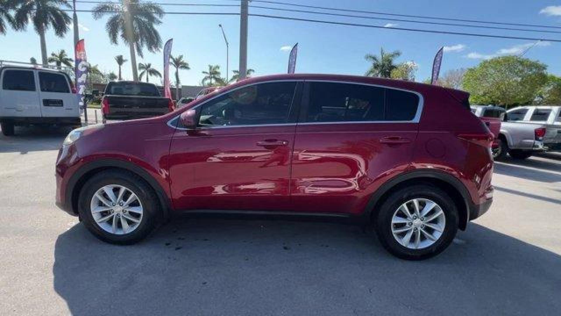 2017 Hyper Red /Black Kia Sportage (KNDPM3AC6H7) with an 4 2.4 L engine, Automatic transmission, located at 27610 S Dixie Hwy, Homestead, FL, 33032, (305) 749-2348, 25.510241, -80.438301 - IIHS Top Safety Pick, Top Safety Pick+. Delivers 30 Highway MPG and 23 City MPG! This Kia Sportage boasts a Regular Unleaded I-4 2.4 L/144 engine powering this Automatic transmission. WHEEL LOCKS, HYPER RED, CARPET FLOOR MATS.* This Kia Sportage Features the Following Options *BLACK, CLOTH SEAT TRIM - Photo#1