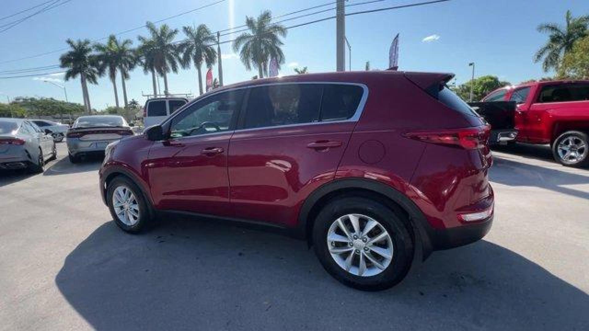 2017 Hyper Red /Black Kia Sportage (KNDPM3AC6H7) with an 4 2.4 L engine, Automatic transmission, located at 27610 S Dixie Hwy, Homestead, FL, 33032, (305) 749-2348, 25.510241, -80.438301 - IIHS Top Safety Pick, Top Safety Pick+. Delivers 30 Highway MPG and 23 City MPG! This Kia Sportage boasts a Regular Unleaded I-4 2.4 L/144 engine powering this Automatic transmission. WHEEL LOCKS, HYPER RED, CARPET FLOOR MATS.* This Kia Sportage Features the Following Options *BLACK, CLOTH SEAT TRIM - Photo#2