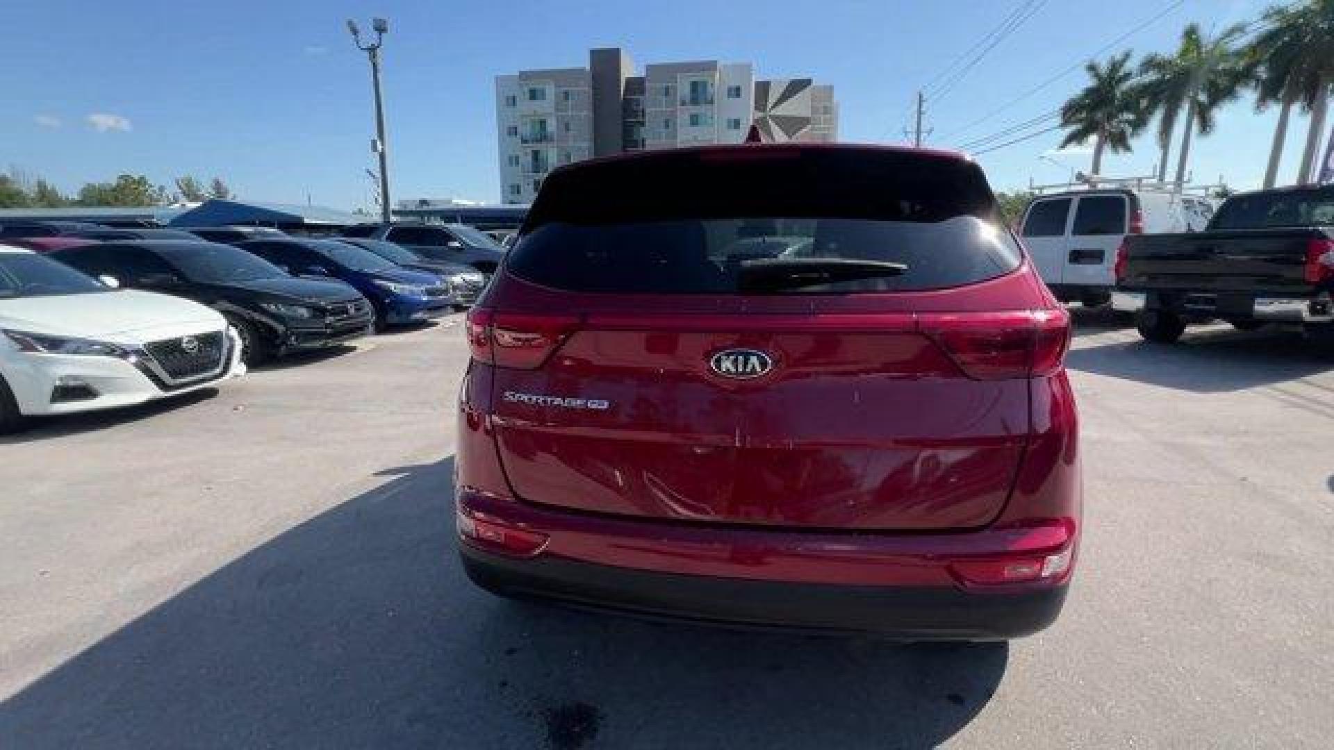 2017 Hyper Red /Black Kia Sportage (KNDPM3AC6H7) with an 4 2.4 L engine, Automatic transmission, located at 27610 S Dixie Hwy, Homestead, FL, 33032, (305) 749-2348, 25.510241, -80.438301 - IIHS Top Safety Pick, Top Safety Pick+. Delivers 30 Highway MPG and 23 City MPG! This Kia Sportage boasts a Regular Unleaded I-4 2.4 L/144 engine powering this Automatic transmission. WHEEL LOCKS, HYPER RED, CARPET FLOOR MATS.* This Kia Sportage Features the Following Options *BLACK, CLOTH SEAT TRIM - Photo#3