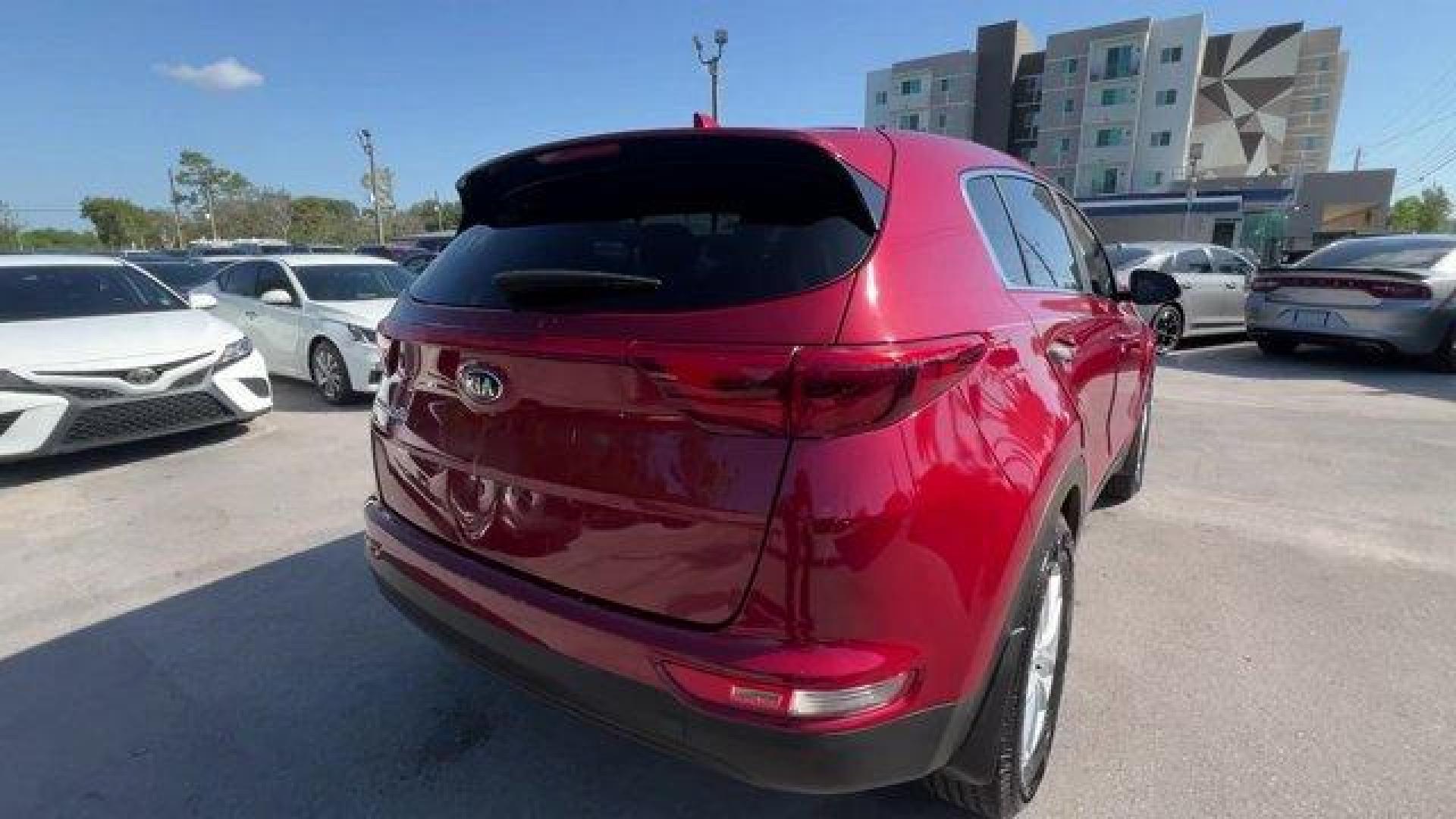 2017 Hyper Red /Black Kia Sportage (KNDPM3AC6H7) with an 4 2.4 L engine, Automatic transmission, located at 27610 S Dixie Hwy, Homestead, FL, 33032, (305) 749-2348, 25.510241, -80.438301 - IIHS Top Safety Pick, Top Safety Pick+. Delivers 30 Highway MPG and 23 City MPG! This Kia Sportage boasts a Regular Unleaded I-4 2.4 L/144 engine powering this Automatic transmission. WHEEL LOCKS, HYPER RED, CARPET FLOOR MATS.* This Kia Sportage Features the Following Options *BLACK, CLOTH SEAT TRIM - Photo#4