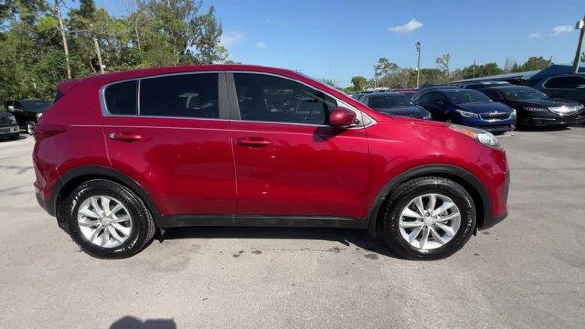 2017 Hyper Red /Black Kia Sportage (KNDPM3AC6H7) with an 4 2.4 L engine, Automatic transmission, located at 27610 S Dixie Hwy, Homestead, FL, 33032, (305) 749-2348, 25.510241, -80.438301 - IIHS Top Safety Pick, Top Safety Pick+. Delivers 30 Highway MPG and 23 City MPG! This Kia Sportage boasts a Regular Unleaded I-4 2.4 L/144 engine powering this Automatic transmission. WHEEL LOCKS, HYPER RED, CARPET FLOOR MATS.* This Kia Sportage Features the Following Options *BLACK, CLOTH SEAT TRIM - Photo#5
