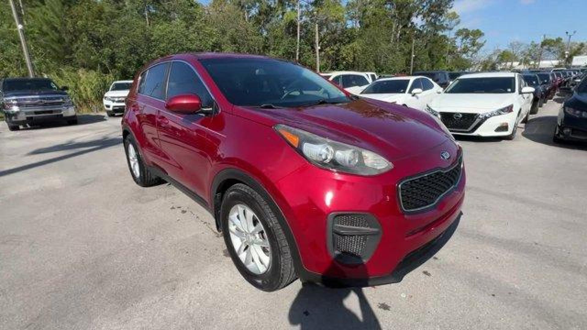2017 Hyper Red /Black Kia Sportage (KNDPM3AC6H7) with an 4 2.4 L engine, Automatic transmission, located at 27610 S Dixie Hwy, Homestead, FL, 33032, (305) 749-2348, 25.510241, -80.438301 - IIHS Top Safety Pick, Top Safety Pick+. Delivers 30 Highway MPG and 23 City MPG! This Kia Sportage boasts a Regular Unleaded I-4 2.4 L/144 engine powering this Automatic transmission. WHEEL LOCKS, HYPER RED, CARPET FLOOR MATS.* This Kia Sportage Features the Following Options *BLACK, CLOTH SEAT TRIM - Photo#6