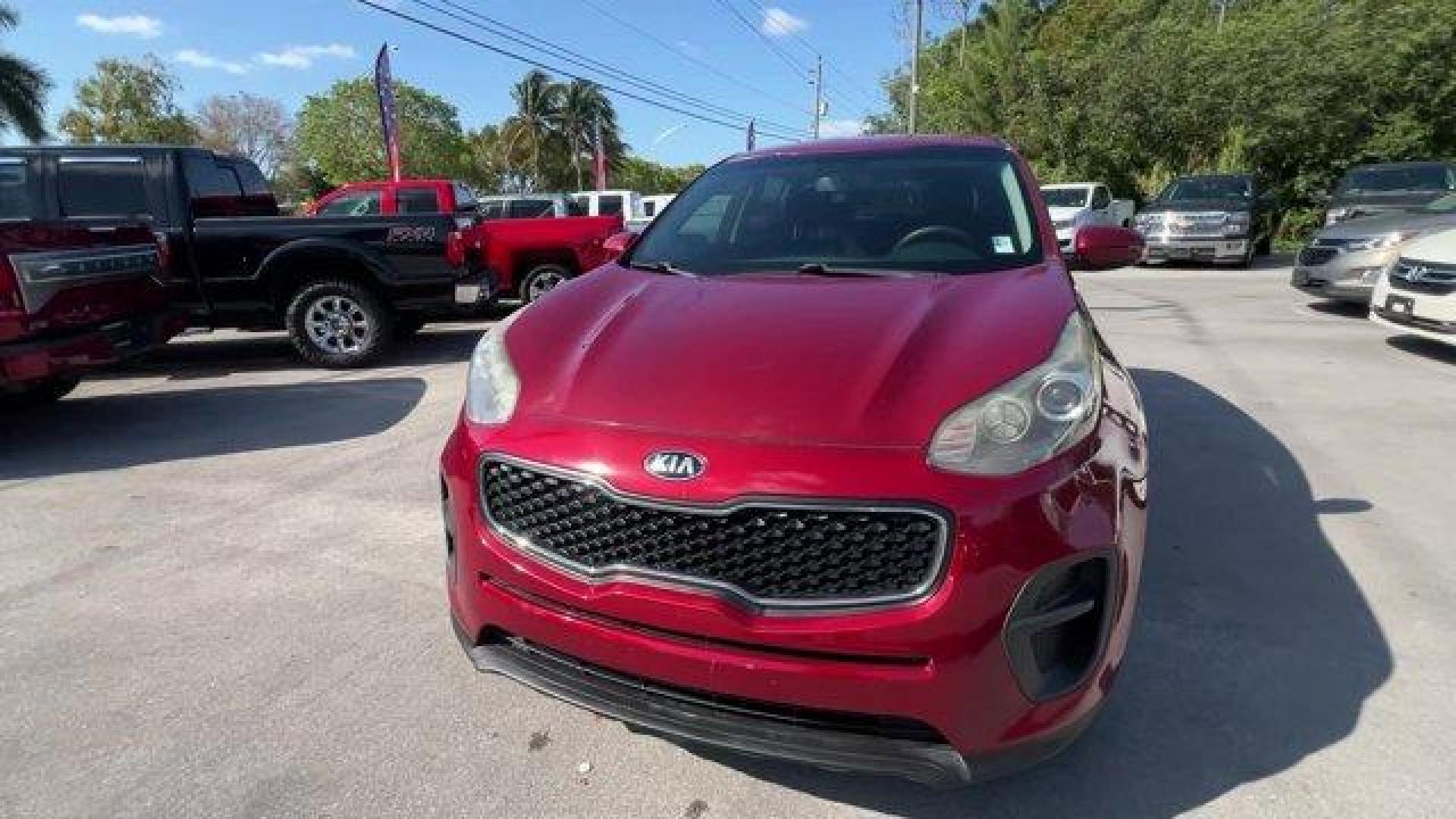 2017 Hyper Red /Black Kia Sportage (KNDPM3AC6H7) with an 4 2.4 L engine, Automatic transmission, located at 27610 S Dixie Hwy, Homestead, FL, 33032, (305) 749-2348, 25.510241, -80.438301 - IIHS Top Safety Pick, Top Safety Pick+. Delivers 30 Highway MPG and 23 City MPG! This Kia Sportage boasts a Regular Unleaded I-4 2.4 L/144 engine powering this Automatic transmission. WHEEL LOCKS, HYPER RED, CARPET FLOOR MATS.* This Kia Sportage Features the Following Options *BLACK, CLOTH SEAT TRIM - Photo#7