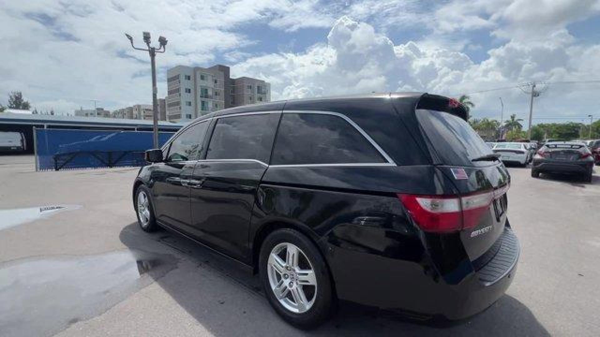 2012 Black Honda Odyssey (5FNRL5H96CB) with an 6 3.5L engine, Automatic transmission, located at 27610 S Dixie Hwy, Homestead, FL, 33032, (305) 749-2348, 25.510241, -80.438301 - KBB.com 10 Best Used Family Cars Under $15,000. Scores 28 Highway MPG and 19 City MPG! This Honda Odyssey boasts a Gas V6 3.5L/212 engine powering this Automatic transmission. XM Radio (subscription required), Wide-mode adjustable 2nd-row seats -inc: leather trimmed outboard seats, multi-function ce - Photo#2