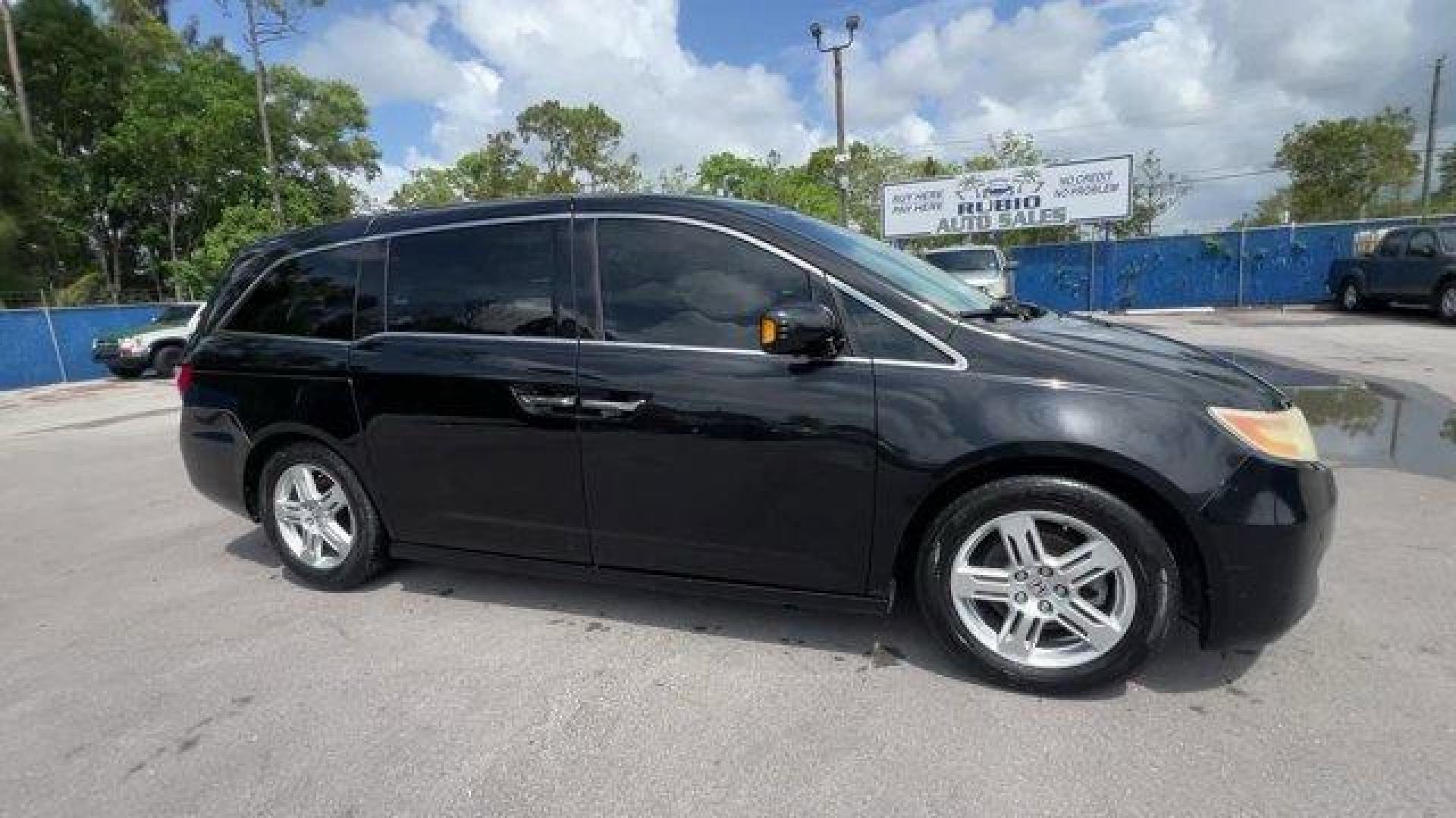 2012 Black Honda Odyssey (5FNRL5H96CB) with an 6 3.5L engine, Automatic transmission, located at 27610 S Dixie Hwy, Homestead, FL, 33032, (305) 749-2348, 25.510241, -80.438301 - KBB.com 10 Best Used Family Cars Under $15,000. Scores 28 Highway MPG and 19 City MPG! This Honda Odyssey boasts a Gas V6 3.5L/212 engine powering this Automatic transmission. XM Radio (subscription required), Wide-mode adjustable 2nd-row seats -inc: leather trimmed outboard seats, multi-function ce - Photo#5