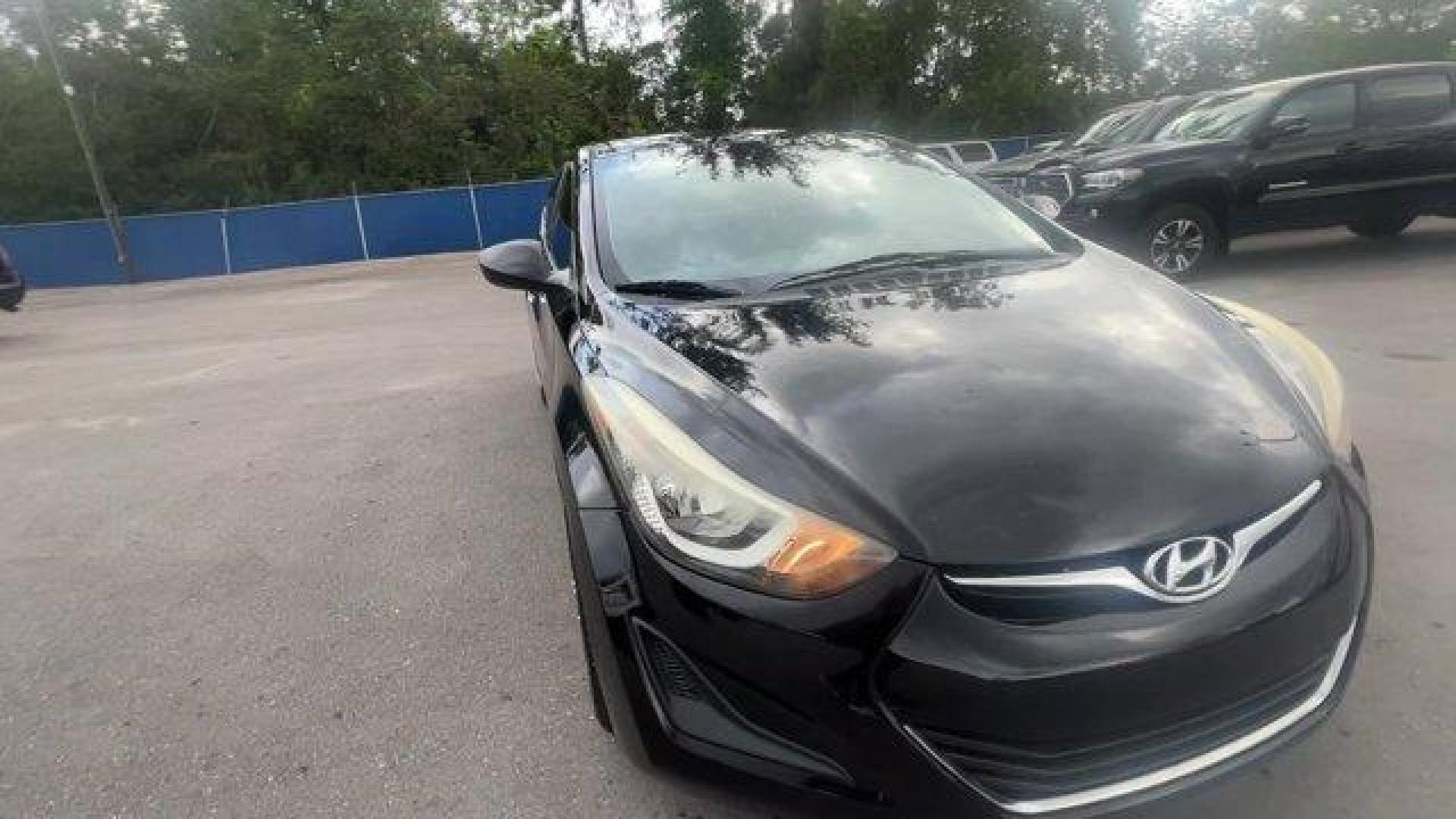 2016 Phantom Black /Gray Hyundai Elantra (5NPDH4AE4GH) with an 4 1.8 L engine, Automatic transmission, located at 27610 S Dixie Hwy, Homestead, FL, 33032, (305) 749-2348, 25.510241, -80.438301 - KBB.com Best Buy Awards Finalist. Only 93,329 Miles! Delivers 38 Highway MPG and 28 City MPG! This Hyundai Elantra boasts a Regular Unleaded I-4 1.8 L/110 engine powering this Automatic transmission. REAR BUMPER APPLIQUE, PHANTOM BLACK, GRAY, PREMIUM CLOTH SEAT TRIM.*This Hyundai Elantra Comes Equip - Photo#6