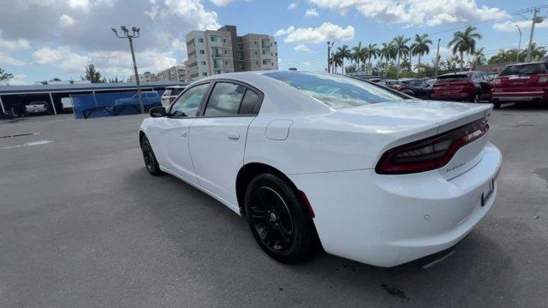 2020 White Knuckle Clearcoat /Black Dodge Charger (2C3CDXBG0LH) with an 6 3.6 L engine, Automatic transmission, located at 27610 S Dixie Hwy, Homestead, FL, 33032, (305) 749-2348, 25.510241, -80.438301 - Boasts 30 Highway MPG and 19 City MPG! This Dodge Charger boasts a Regular Unleaded V-6 3.6 L/220 engine powering this Automatic transmission. WHITE KNUCKLE CLEARCOAT, WHEELS: 17 X 7.0 PAINTED CAST ALUMINUM (STD), TRANSMISSION: 8-SPEED AUTOMATIC (8HP50) (STD).*This Dodge Charger Comes Equipped with - Photo#2