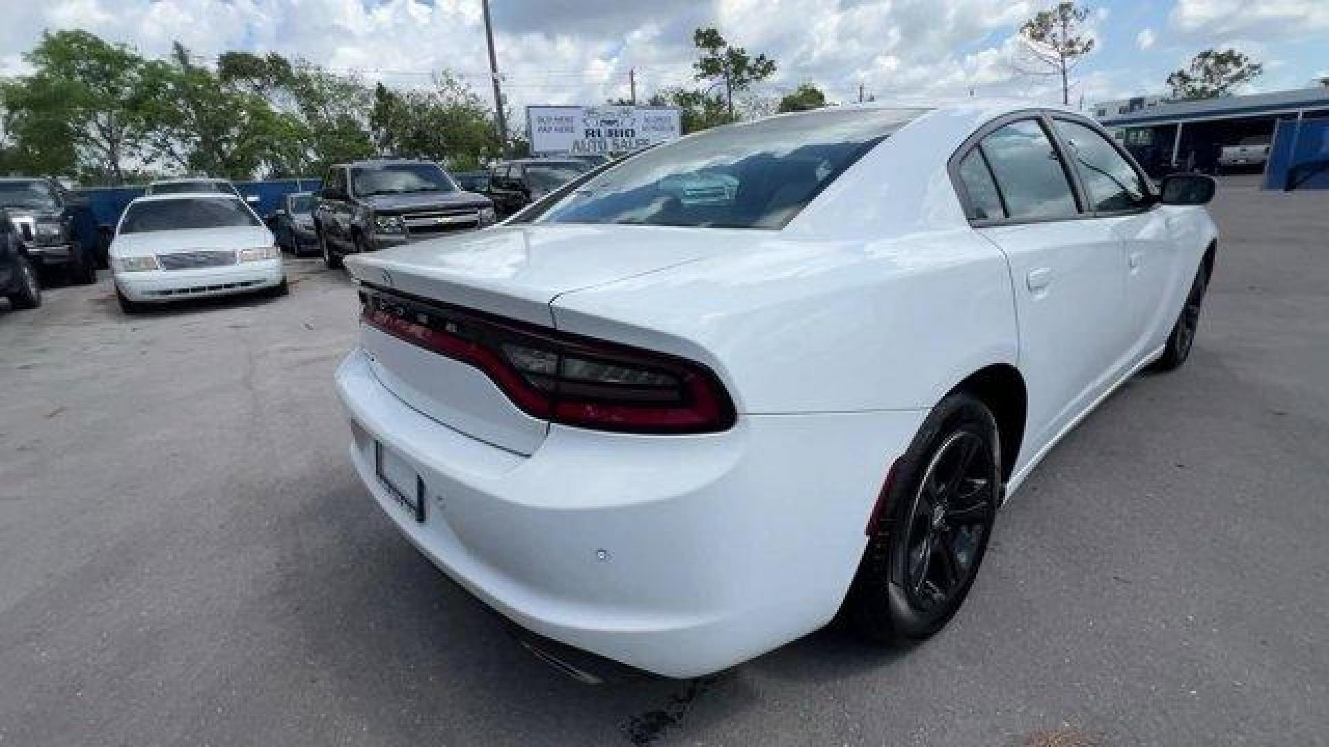 2020 White Knuckle Clearcoat /Black Dodge Charger (2C3CDXBG0LH) with an 6 3.6 L engine, Automatic transmission, located at 27610 S Dixie Hwy, Homestead, FL, 33032, (305) 749-2348, 25.510241, -80.438301 - Boasts 30 Highway MPG and 19 City MPG! This Dodge Charger boasts a Regular Unleaded V-6 3.6 L/220 engine powering this Automatic transmission. WHITE KNUCKLE CLEARCOAT, WHEELS: 17 X 7.0 PAINTED CAST ALUMINUM (STD), TRANSMISSION: 8-SPEED AUTOMATIC (8HP50) (STD).*This Dodge Charger Comes Equipped with - Photo#4