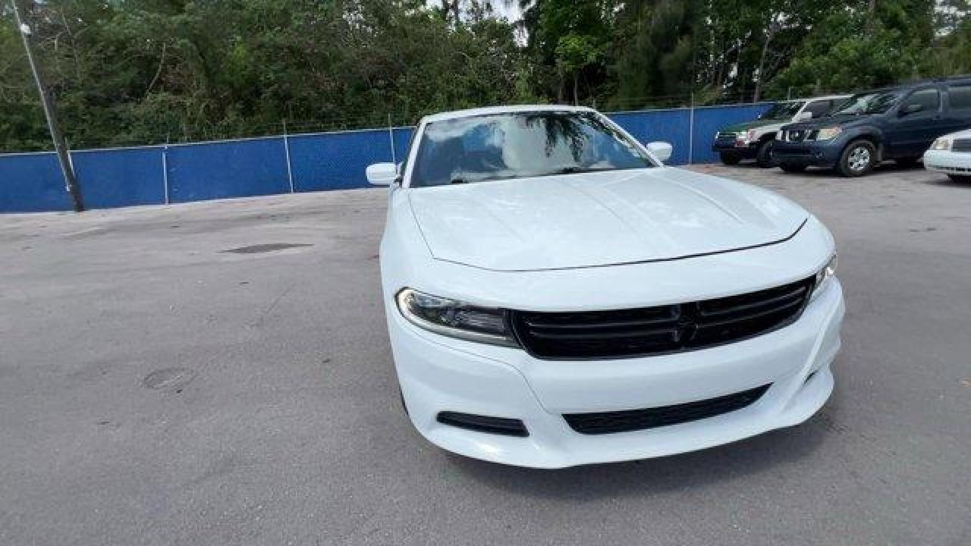 2020 White Knuckle Clearcoat /Black Dodge Charger (2C3CDXBG0LH) with an 6 3.6 L engine, Automatic transmission, located at 27610 S Dixie Hwy, Homestead, FL, 33032, (305) 749-2348, 25.510241, -80.438301 - Boasts 30 Highway MPG and 19 City MPG! This Dodge Charger boasts a Regular Unleaded V-6 3.6 L/220 engine powering this Automatic transmission. WHITE KNUCKLE CLEARCOAT, WHEELS: 17 X 7.0 PAINTED CAST ALUMINUM (STD), TRANSMISSION: 8-SPEED AUTOMATIC (8HP50) (STD).*This Dodge Charger Comes Equipped with - Photo#7