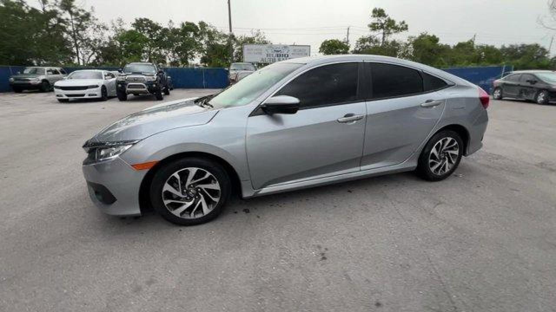 2018 Gray Honda Civic Sedan (2HGFC2F83JH) with an 4 2.0 L engine, Variable transmission, located at 27610 S Dixie Hwy, Homestead, FL, 33032, (305) 749-2348, 25.510241, -80.438301 - KBB.com 10 Most Awarded Brands. Only 56,766 Miles! Boasts 40 Highway MPG and 31 City MPG! This Honda Civic Sedan delivers a Regular Unleaded I-4 2.0 L/122 engine powering this Variable transmission. Wheels: 16 Alloy, Wheels w/Silver Accents, VSA Electronic Stability Control (ESC).*This Honda Civic S - Photo#1