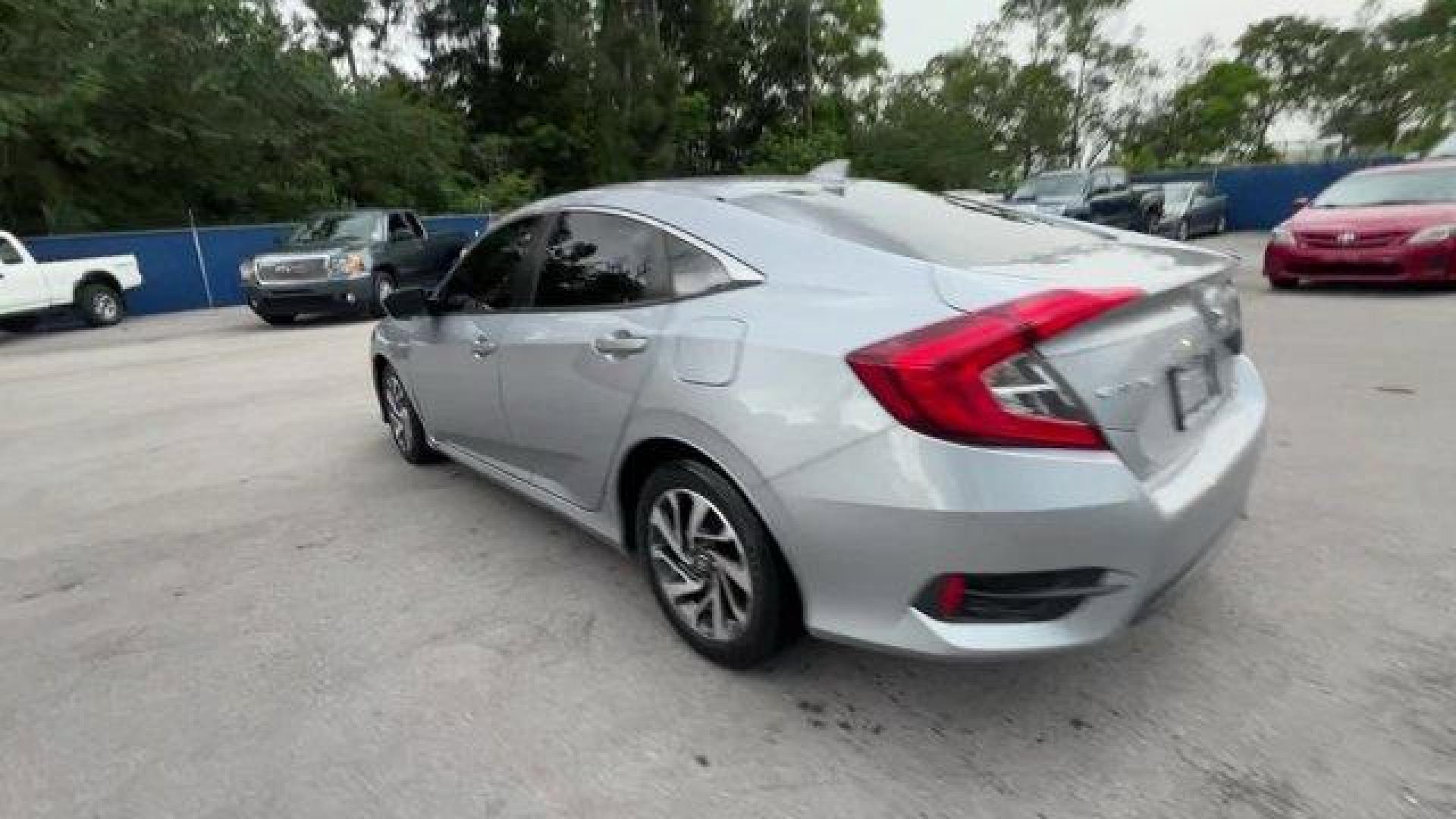 2018 Gray Honda Civic Sedan (2HGFC2F83JH) with an 4 2.0 L engine, Variable transmission, located at 27610 S Dixie Hwy, Homestead, FL, 33032, (305) 749-2348, 25.510241, -80.438301 - KBB.com 10 Most Awarded Brands. Only 56,766 Miles! Boasts 40 Highway MPG and 31 City MPG! This Honda Civic Sedan delivers a Regular Unleaded I-4 2.0 L/122 engine powering this Variable transmission. Wheels: 16 Alloy, Wheels w/Silver Accents, VSA Electronic Stability Control (ESC).*This Honda Civic S - Photo#2