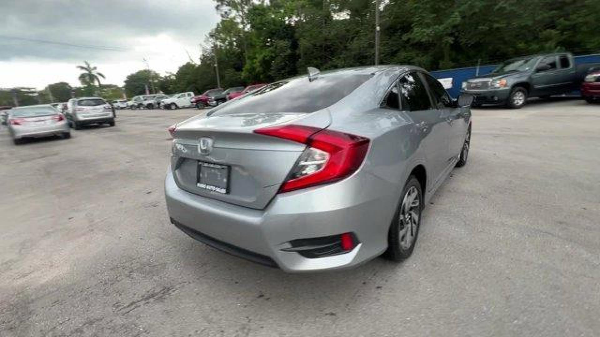 2018 Gray Honda Civic Sedan (2HGFC2F83JH) with an 4 2.0 L engine, Variable transmission, located at 27610 S Dixie Hwy, Homestead, FL, 33032, (305) 749-2348, 25.510241, -80.438301 - KBB.com 10 Most Awarded Brands. Only 56,766 Miles! Boasts 40 Highway MPG and 31 City MPG! This Honda Civic Sedan delivers a Regular Unleaded I-4 2.0 L/122 engine powering this Variable transmission. Wheels: 16 Alloy, Wheels w/Silver Accents, VSA Electronic Stability Control (ESC).*This Honda Civic S - Photo#4