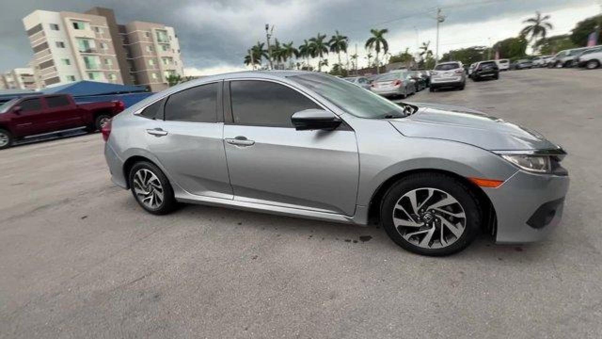 2018 Gray Honda Civic Sedan (2HGFC2F83JH) with an 4 2.0 L engine, Variable transmission, located at 27610 S Dixie Hwy, Homestead, FL, 33032, (305) 749-2348, 25.510241, -80.438301 - KBB.com 10 Most Awarded Brands. Only 56,766 Miles! Boasts 40 Highway MPG and 31 City MPG! This Honda Civic Sedan delivers a Regular Unleaded I-4 2.0 L/122 engine powering this Variable transmission. Wheels: 16 Alloy, Wheels w/Silver Accents, VSA Electronic Stability Control (ESC).*This Honda Civic S - Photo#5