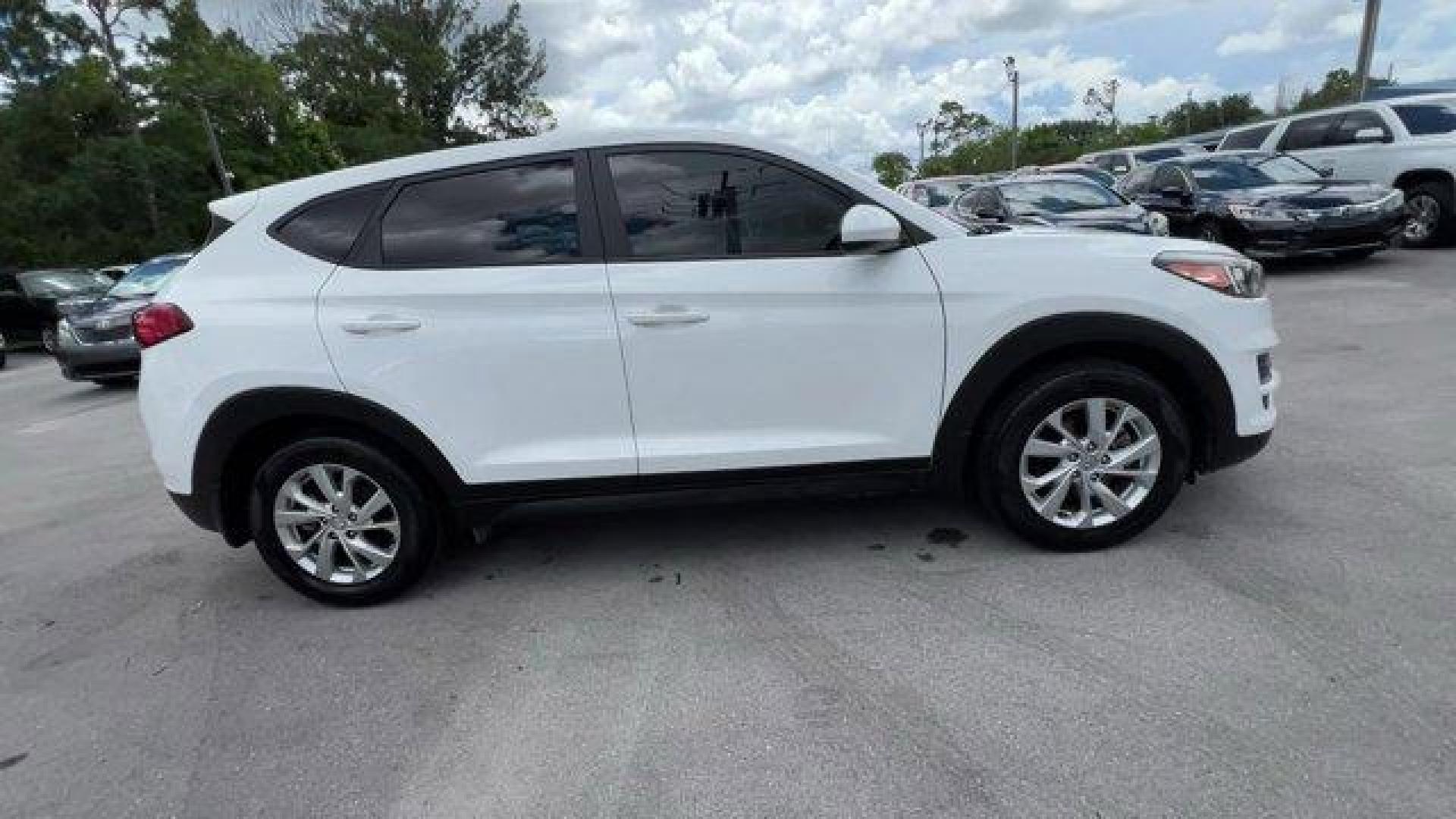 2020 Winter White /Gray Hyundai Tucson (KM8J23A42LU) with an 4 2.0 L engine, Automatic transmission, located at 27610 S Dixie Hwy, Homestead, FL, 33032, (305) 749-2348, 25.510241, -80.438301 - Scores 28 Highway MPG and 23 City MPG! This Hyundai Tucson delivers a Regular Unleaded I-4 2.0 L/122 engine powering this Automatic transmission. WINTER WHITE, REVERSIBLE CARGO TRAY -inc: rubber-like non-slip protective cover for rear cargo compartment, OPTION GROUP 01.*This Hyundai Tucson Comes Equ - Photo#4