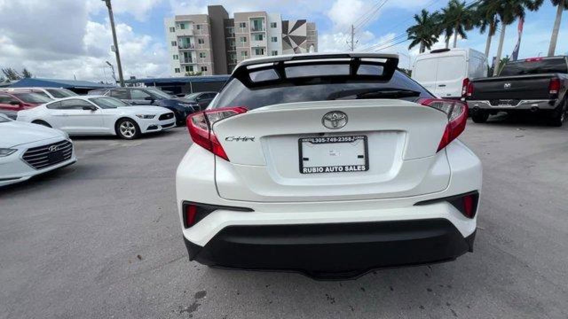 2019 White Toyota C-HR (JTNKHMBX8K1) with an 4 2.0 L engine, Variable transmission, located at 27610 S Dixie Hwy, Homestead, FL, 33032, (305) 749-2348, 25.510241, -80.438301 - KBB.com Brand Image Awards. Scores 31 Highway MPG and 27 City MPG! This Toyota C-HR delivers a Regular Unleaded I-4 2.0 L/121 engine powering this Variable transmission. Wing Spoiler, VSC Electronic Stability Control (ESC), Variable Intermittent Wipers.*This Toyota C-HR Comes Equipped with These Opt - Photo#4