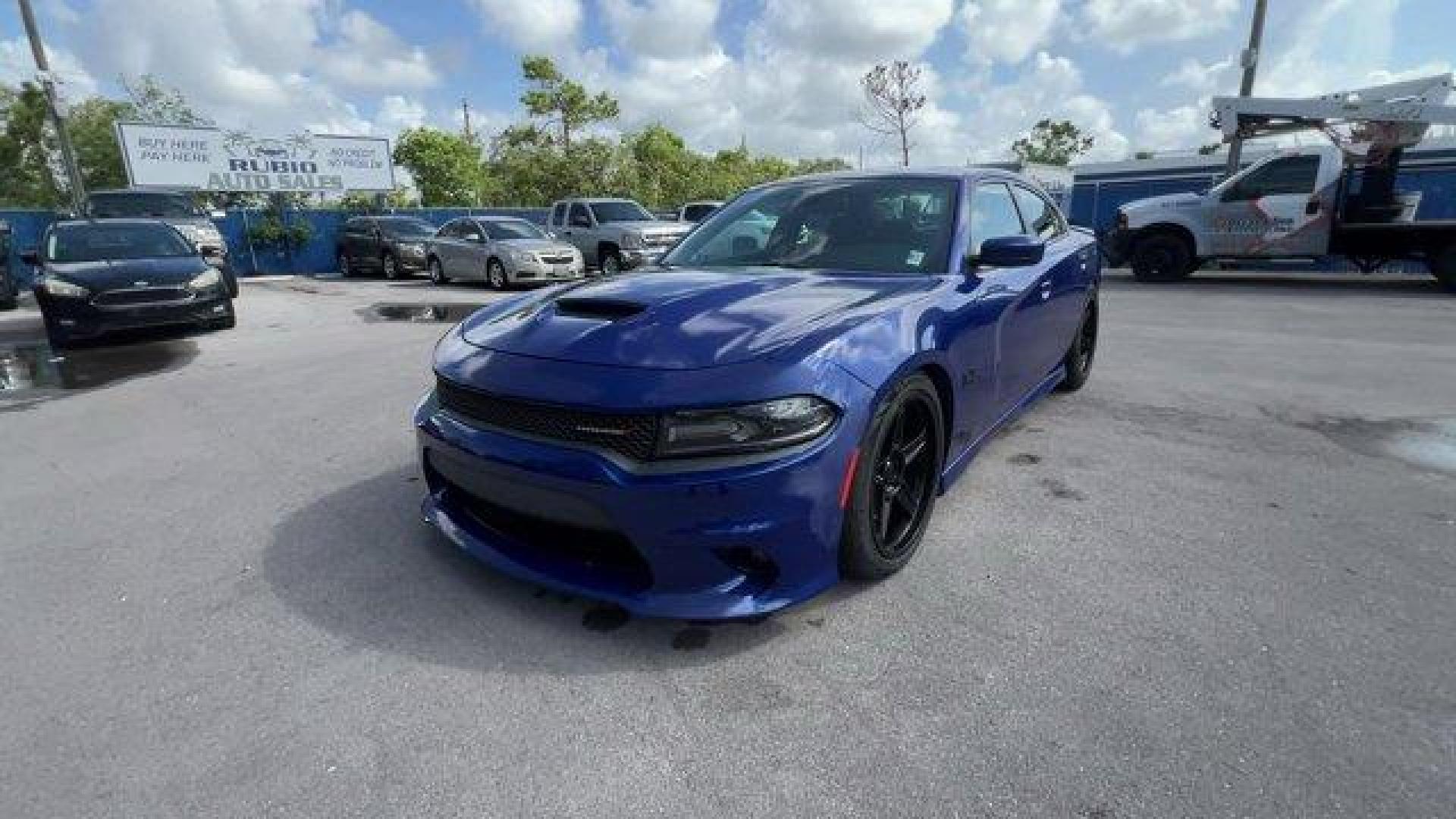 2019 Indigo Blue /Black Dodge Charger (2C3CDXCT5KH) with an 8 5.7 L engine, Automatic transmission, located at 27610 S Dixie Hwy, Homestead, FL, 33032, (305) 749-2348, 25.510241, -80.438301 - KBB.com Best Resale Value Awards. Only 17,596 Miles! Scores 25 Highway MPG and 16 City MPG! This Dodge Charger delivers a Regular Unleaded V-8 5.7 L/345 engine powering this Automatic transmission. WHEELS: 20 X 8.0 GRANITE CRYSTAL ALUMINUM (STD), TRANSMISSION: 8-SPEED AUTOMATIC (8HP70) (STD), TIRES: - Photo#0