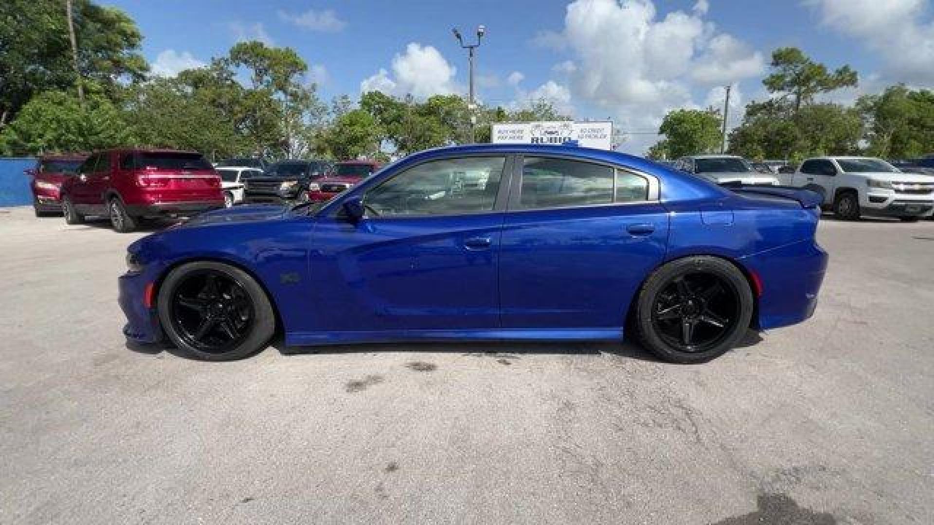 2019 Indigo Blue /Black Dodge Charger (2C3CDXCT5KH) with an 8 5.7 L engine, Automatic transmission, located at 27610 S Dixie Hwy, Homestead, FL, 33032, (305) 749-2348, 25.510241, -80.438301 - KBB.com Best Resale Value Awards. Only 17,596 Miles! Scores 25 Highway MPG and 16 City MPG! This Dodge Charger delivers a Regular Unleaded V-8 5.7 L/345 engine powering this Automatic transmission. WHEELS: 20 X 8.0 GRANITE CRYSTAL ALUMINUM (STD), TRANSMISSION: 8-SPEED AUTOMATIC (8HP70) (STD), TIRES: - Photo#1