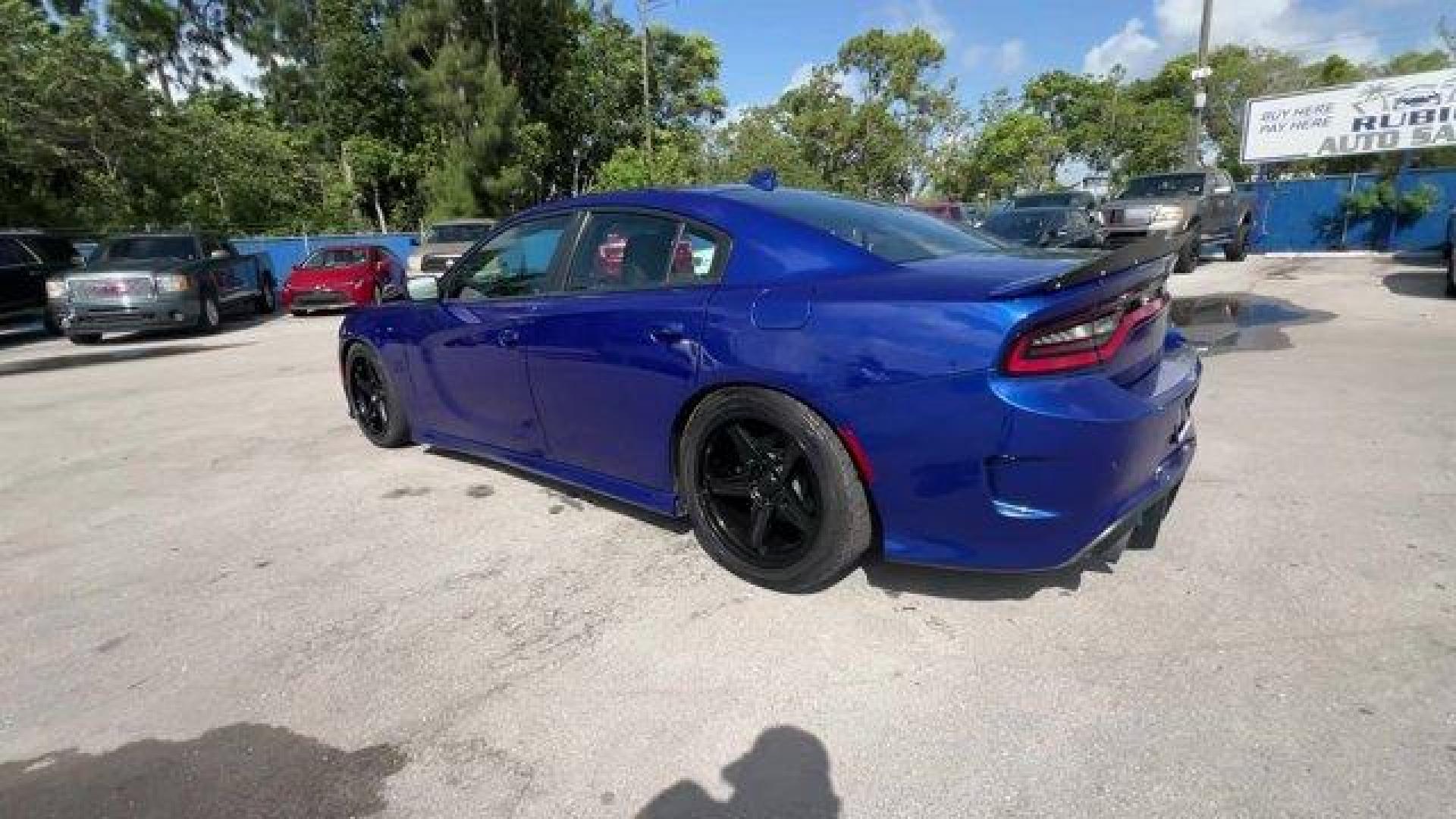 2019 Indigo Blue /Black Dodge Charger (2C3CDXCT5KH) with an 8 5.7 L engine, Automatic transmission, located at 27610 S Dixie Hwy, Homestead, FL, 33032, (305) 749-2348, 25.510241, -80.438301 - KBB.com Best Resale Value Awards. Only 17,596 Miles! Scores 25 Highway MPG and 16 City MPG! This Dodge Charger delivers a Regular Unleaded V-8 5.7 L/345 engine powering this Automatic transmission. WHEELS: 20 X 8.0 GRANITE CRYSTAL ALUMINUM (STD), TRANSMISSION: 8-SPEED AUTOMATIC (8HP70) (STD), TIRES: - Photo#2