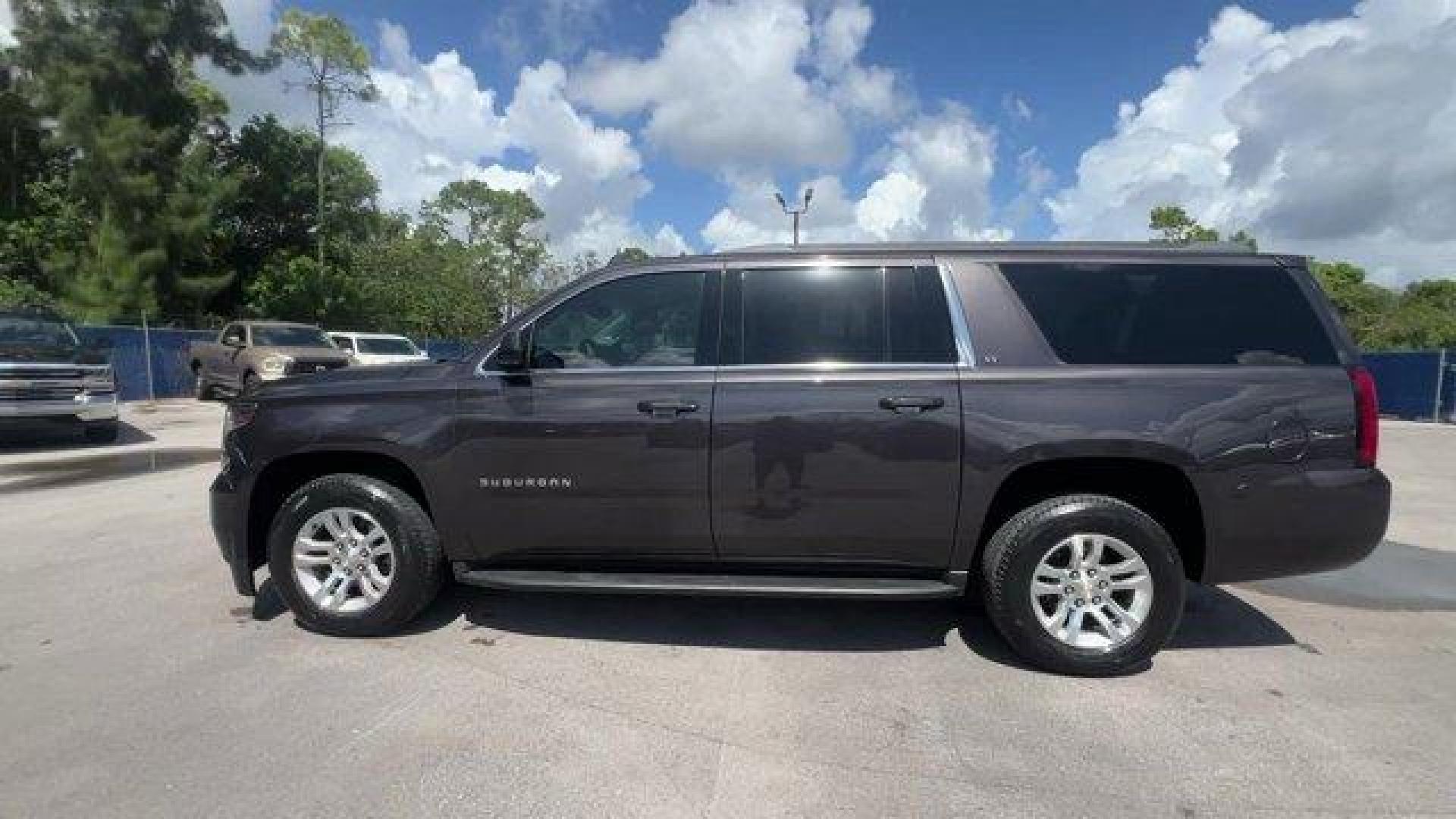 2016 Tungsten Metallic /Jet Black Chevrolet Suburban (1GNSKHKC2GR) with an 8 5.3L engine, Automatic transmission, located at 27610 S Dixie Hwy, Homestead, FL, 33032, (305) 749-2348, 25.510241, -80.438301 - Scores 22 Highway MPG and 15 City MPG! This Chevrolet Suburban boasts a Gas/Ethanol V8 5.3L/ engine powering this Automatic transmission. WHEELS, 18 X 8.5 (45.7 CM X 21.6 CM) ALUMINUM WITH HIGH-POLISHED FINISH (STD), TUNGSTEN METALLIC, TRANSMISSION, 6-SPEED AUTOMATIC, ELECTRONICALLY CONTROLLED with - Photo#1