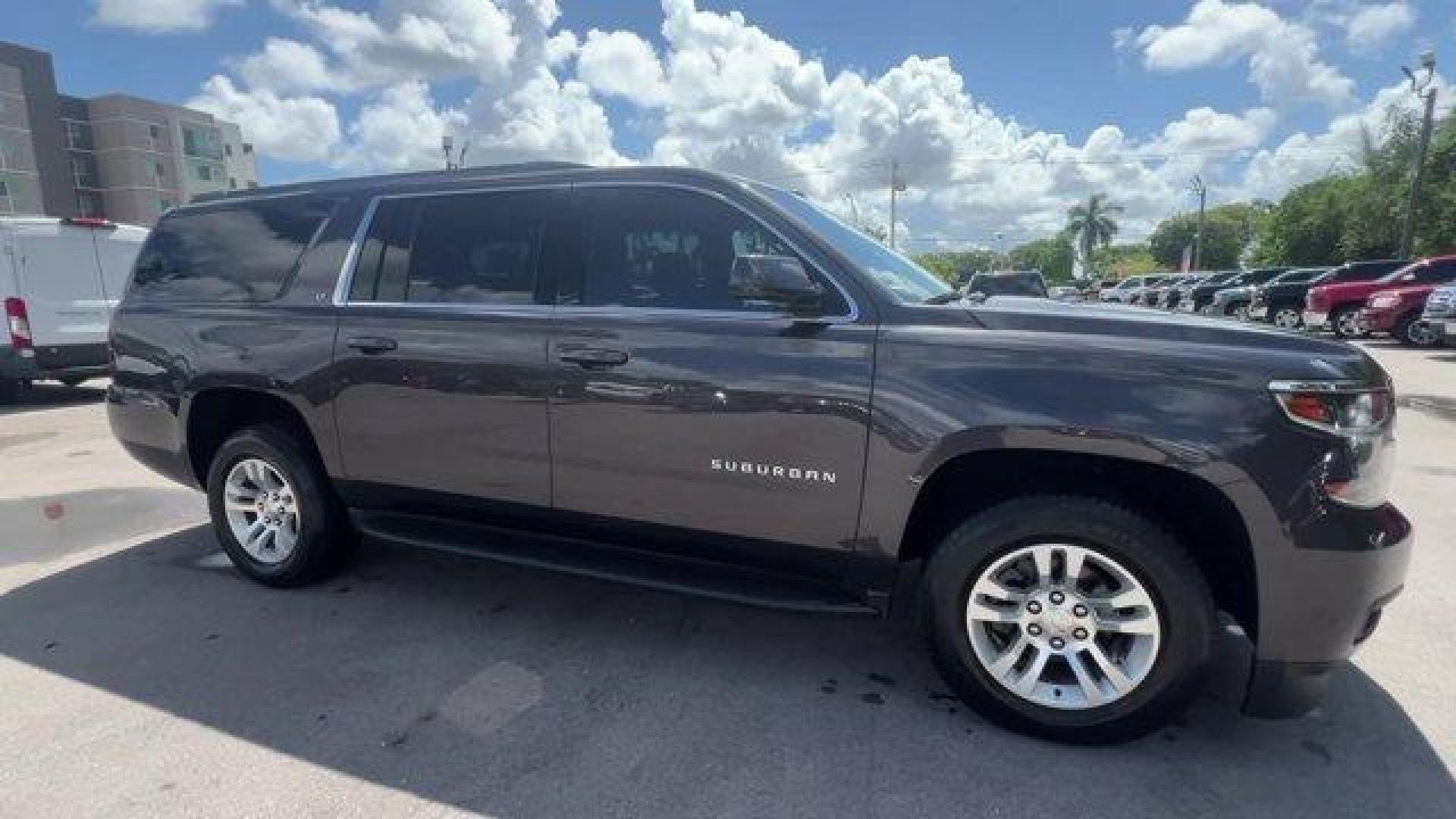 2016 Tungsten Metallic /Jet Black Chevrolet Suburban (1GNSKHKC2GR) with an 8 5.3L engine, Automatic transmission, located at 27610 S Dixie Hwy, Homestead, FL, 33032, (305) 749-2348, 25.510241, -80.438301 - Scores 22 Highway MPG and 15 City MPG! This Chevrolet Suburban boasts a Gas/Ethanol V8 5.3L/ engine powering this Automatic transmission. WHEELS, 18 X 8.5 (45.7 CM X 21.6 CM) ALUMINUM WITH HIGH-POLISHED FINISH (STD), TUNGSTEN METALLIC, TRANSMISSION, 6-SPEED AUTOMATIC, ELECTRONICALLY CONTROLLED with - Photo#5