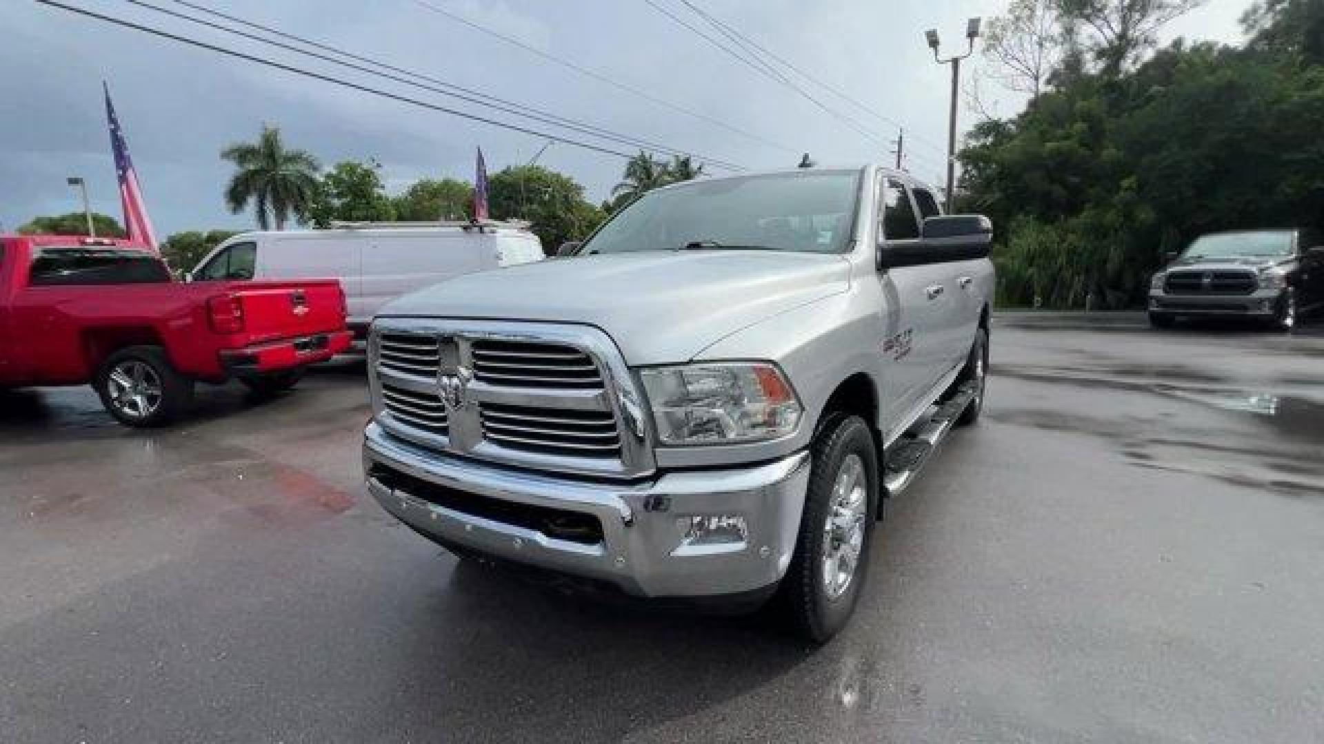 2016 Bright Silver Metallic Clearcoat /Diesel Gray/Black Ram 2500 (3C6UR4DJ4GG) with an 8 6.4 L engine, Automatic transmission, located at 27610 S Dixie Hwy, Homestead, FL, 33032, (305) 749-2348, 25.510241, -80.438301 - This Ram 2500 boasts a Regular Unleaded V-8 6.4 L/392 engine powering this Automatic transmission. WHEELS: 20 X 8.0 PAINTED ALUMINUM W/CHROME INSERTS -inc: Tires: LT285/60R20E OWL On/Off Road, TRANSMISSION: 6-SPEED AUTOMATIC (66RFE) (STD), TOW HOOKS.* This Ram 2500 Features the Following Options *QU - Photo#0