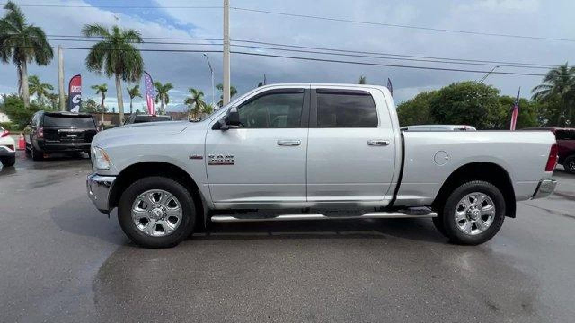 2016 Bright Silver Metallic Clearcoat /Diesel Gray/Black Ram 2500 (3C6UR4DJ4GG) with an 8 6.4 L engine, Automatic transmission, located at 27610 S Dixie Hwy, Homestead, FL, 33032, (305) 749-2348, 25.510241, -80.438301 - This Ram 2500 boasts a Regular Unleaded V-8 6.4 L/392 engine powering this Automatic transmission. WHEELS: 20 X 8.0 PAINTED ALUMINUM W/CHROME INSERTS -inc: Tires: LT285/60R20E OWL On/Off Road, TRANSMISSION: 6-SPEED AUTOMATIC (66RFE) (STD), TOW HOOKS.* This Ram 2500 Features the Following Options *QU - Photo#1