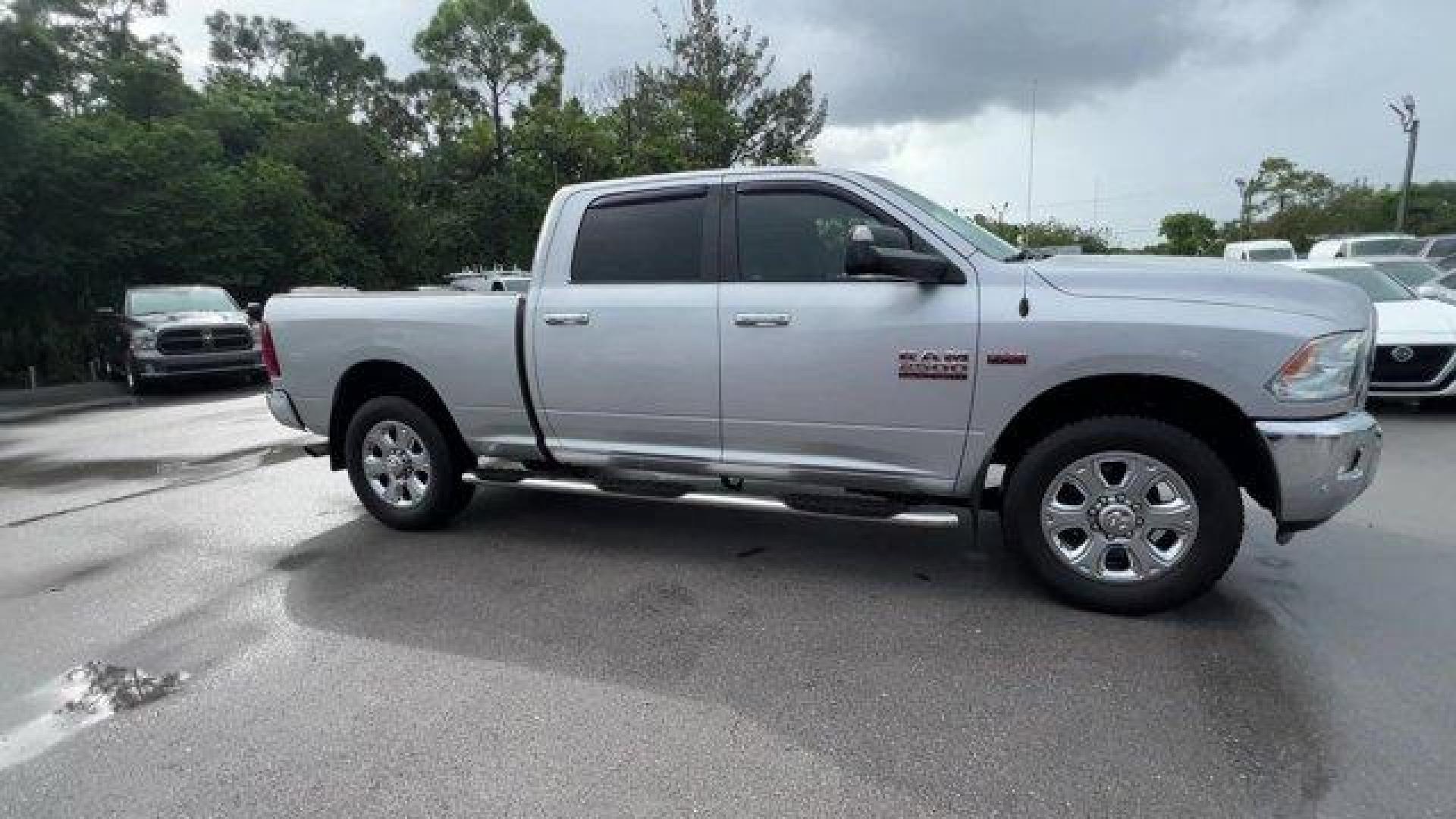 2016 Bright Silver Metallic Clearcoat /Diesel Gray/Black Ram 2500 (3C6UR4DJ4GG) with an 8 6.4 L engine, Automatic transmission, located at 27610 S Dixie Hwy, Homestead, FL, 33032, (305) 749-2348, 25.510241, -80.438301 - This Ram 2500 boasts a Regular Unleaded V-8 6.4 L/392 engine powering this Automatic transmission. WHEELS: 20 X 8.0 PAINTED ALUMINUM W/CHROME INSERTS -inc: Tires: LT285/60R20E OWL On/Off Road, TRANSMISSION: 6-SPEED AUTOMATIC (66RFE) (STD), TOW HOOKS.* This Ram 2500 Features the Following Options *QU - Photo#5