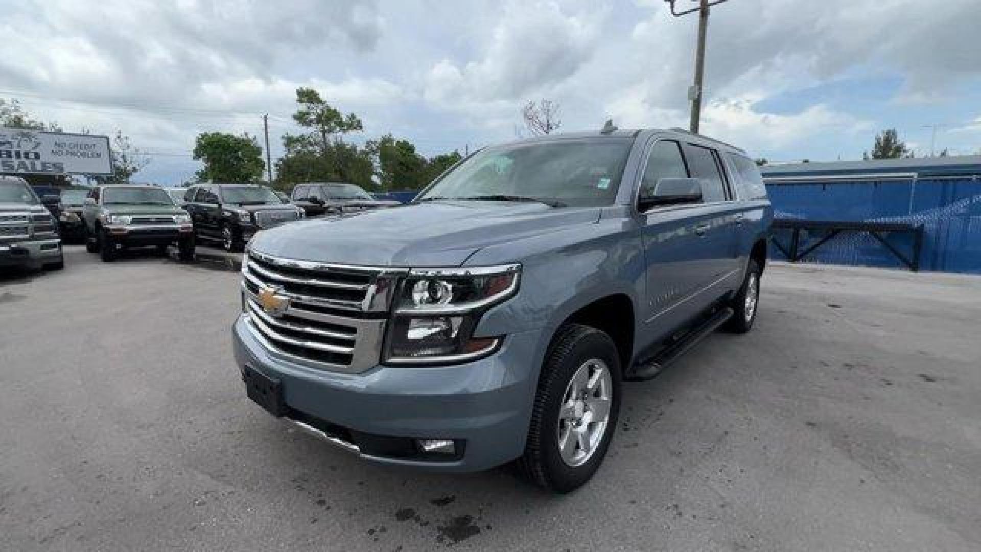 2016 Slate Grey Metallic /Jet Black/Dark Ash Chevrolet Suburban (1GNSKHKCXGR) with an 8 5.3L engine, Automatic transmission, located at 27610 S Dixie Hwy, Homestead, FL, 33032, (305) 749-2348, 25.510241, -80.438301 - Boasts 22 Highway MPG and 15 City MPG! This Chevrolet Suburban boasts a Gas/Ethanol V8 5.3L/ engine powering this Automatic transmission. WIRELESS CHARGING, WHEELS, 18 X 8.5 (45.7 CM X 21.6 CM) PAINTED ALUMINUM, UNDERBODY SHIELD.* This Chevrolet Suburban Features the Following Options *SUN, ENTERTAI - Photo#0