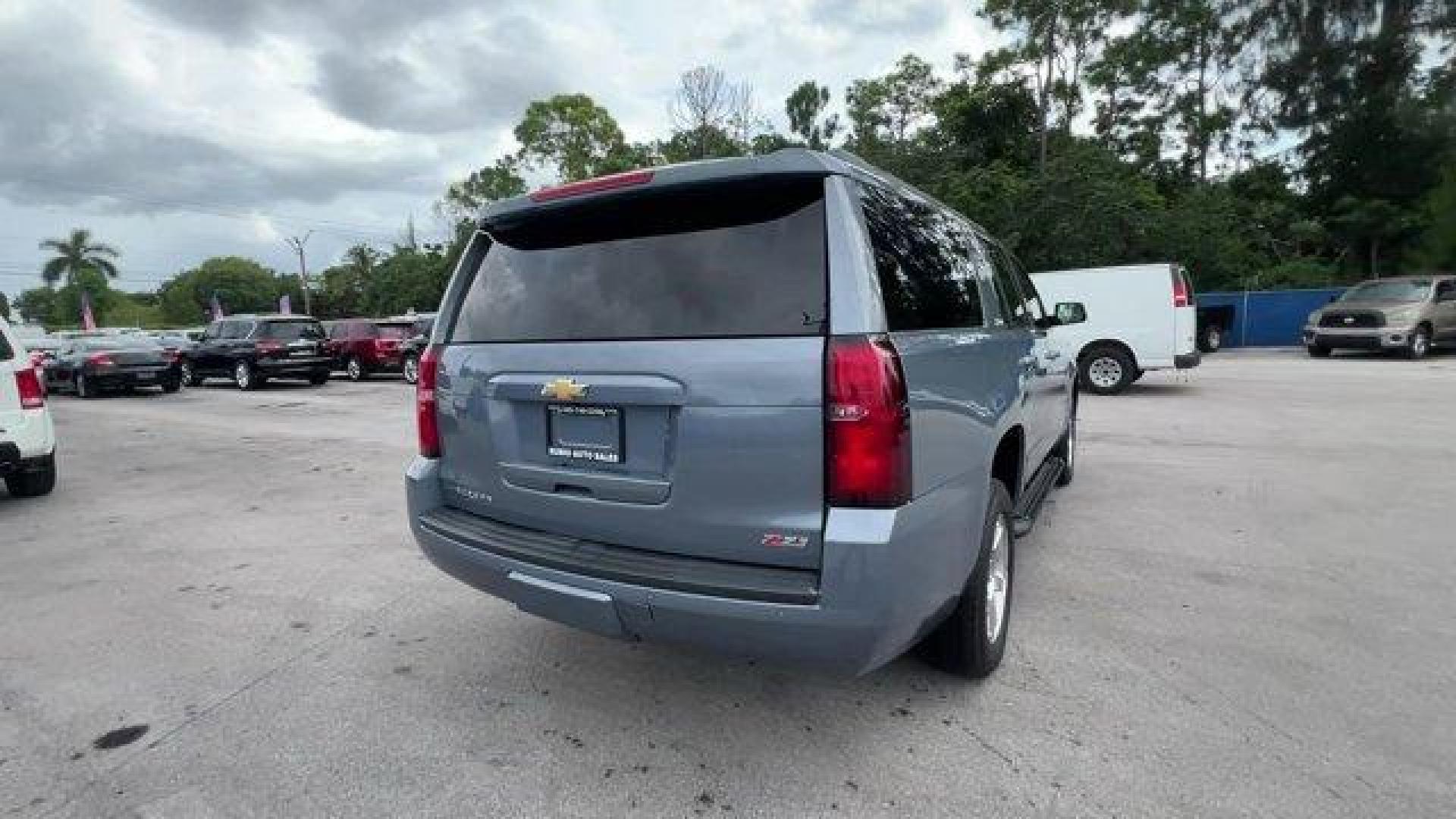 2016 Slate Grey Metallic /Jet Black/Dark Ash Chevrolet Suburban (1GNSKHKCXGR) with an 8 5.3L engine, Automatic transmission, located at 27610 S Dixie Hwy, Homestead, FL, 33032, (305) 749-2348, 25.510241, -80.438301 - Boasts 22 Highway MPG and 15 City MPG! This Chevrolet Suburban boasts a Gas/Ethanol V8 5.3L/ engine powering this Automatic transmission. WIRELESS CHARGING, WHEELS, 18 X 8.5 (45.7 CM X 21.6 CM) PAINTED ALUMINUM, UNDERBODY SHIELD.* This Chevrolet Suburban Features the Following Options *SUN, ENTERTAI - Photo#4