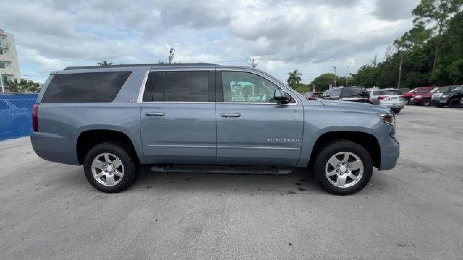 2016 Slate Grey Metallic /Jet Black/Dark Ash Chevrolet Suburban (1GNSKHKCXGR) with an 8 5.3L engine, Automatic transmission, located at 27610 S Dixie Hwy, Homestead, FL, 33032, (305) 749-2348, 25.510241, -80.438301 - Boasts 22 Highway MPG and 15 City MPG! This Chevrolet Suburban boasts a Gas/Ethanol V8 5.3L/ engine powering this Automatic transmission. WIRELESS CHARGING, WHEELS, 18 X 8.5 (45.7 CM X 21.6 CM) PAINTED ALUMINUM, UNDERBODY SHIELD.* This Chevrolet Suburban Features the Following Options *SUN, ENTERTAI - Photo#5