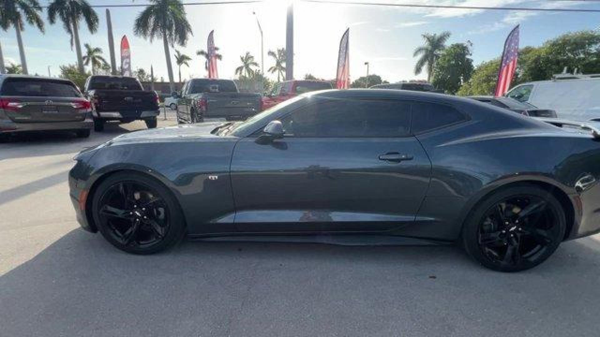 2019 Shadow Gray Metallic /Jet Black Chevrolet Camaro (1G1FB1RXXK0) with an 4 2.0L engine, Automatic transmission, located at 27610 S Dixie Hwy, Homestead, FL, 33032, (305) 749-2348, 25.510241, -80.438301 - KBB.com 10 Coolest Cars Under $30,000. Only 57,139 Miles! Delivers 31 Highway MPG and 22 City MPG! This Chevrolet Camaro boasts a Turbocharged Gas I4 2.0L/122 engine powering this Automatic transmission. WHEELS, 20 (50.8 CM) 5-SPOKE CARBON FLASH PAINTED ALUMINUM, TRANSMISSION, 8-SPEED AUTOMATIC incl - Photo#0