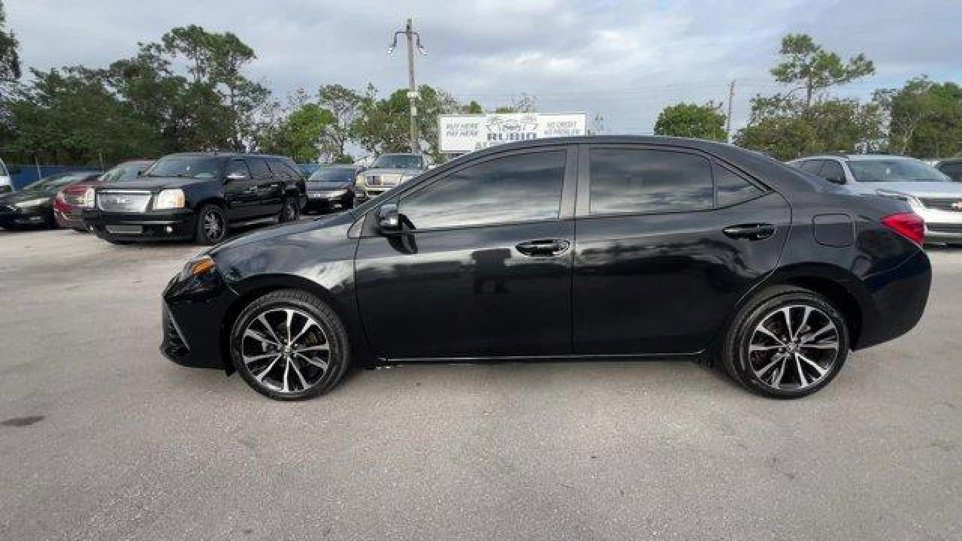 2017 Black Toyota Corolla (5YFBURHE0HP) with an 4 1.8 L engine, Variable transmission, located at 27610 S Dixie Hwy, Homestead, FL, 33032, (305) 749-2348, 25.510241, -80.438301 - KBB.com 10 Best Sedans Under $25,000. This Toyota Corolla delivers a Regular Unleaded I-4 1.8 L/110 engine powering this Variable transmission. Urethane Gear Shifter Material, Trunk Rear Cargo Access, Trip Computer.*This Toyota Corolla Comes Equipped with These Options *Transmission: Continuously Va - Photo#0