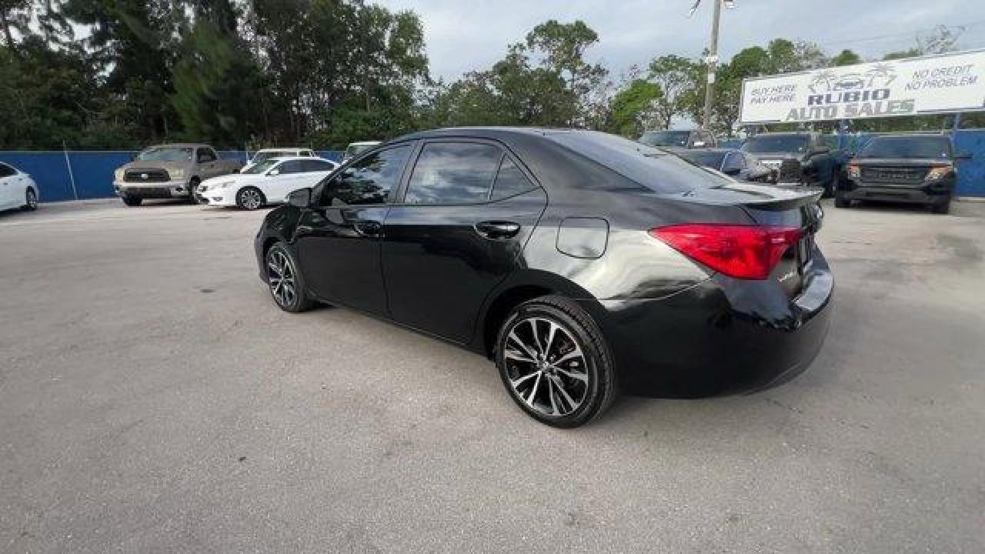 2017 Black Toyota Corolla (5YFBURHE0HP) with an 4 1.8 L engine, Variable transmission, located at 27610 S Dixie Hwy, Homestead, FL, 33032, (305) 749-2348, 25.510241, -80.438301 - KBB.com 10 Best Sedans Under $25,000. This Toyota Corolla delivers a Regular Unleaded I-4 1.8 L/110 engine powering this Variable transmission. Urethane Gear Shifter Material, Trunk Rear Cargo Access, Trip Computer.*This Toyota Corolla Comes Equipped with These Options *Transmission: Continuously Va - Photo#1