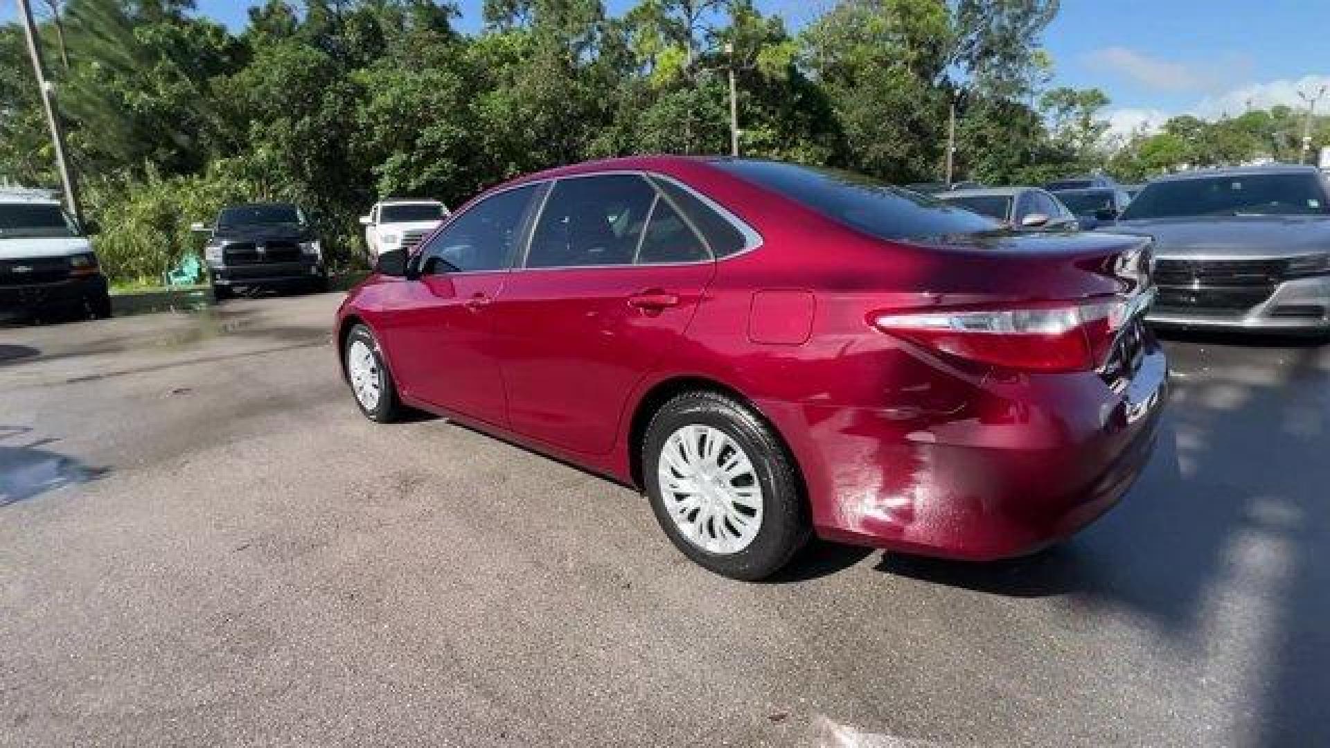 2015 Red Toyota Camry (4T1BF1FK2FU) with an 4 2.5 L engine, Automatic transmission, located at 27610 S Dixie Hwy, Homestead, FL, 33032, (305) 749-2348, 25.510241, -80.438301 - KBB.com 15 Best Family Cars. Delivers 35 Highway MPG and 25 City MPG! This Toyota Camry boasts a Regular Unleaded I-4 2.5 L/152 engine powering this Automatic transmission. Window Grid Antenna, Variable Intermittent Wipers, Valet Function.* This Toyota Camry Features the Following Options *Trunk Rea - Photo#2