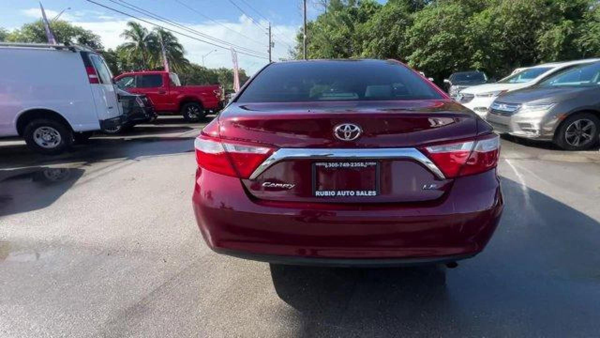 2015 Red Toyota Camry (4T1BF1FK2FU) with an 4 2.5 L engine, Automatic transmission, located at 27610 S Dixie Hwy, Homestead, FL, 33032, (305) 749-2348, 25.510241, -80.438301 - KBB.com 15 Best Family Cars. Delivers 35 Highway MPG and 25 City MPG! This Toyota Camry boasts a Regular Unleaded I-4 2.5 L/152 engine powering this Automatic transmission. Window Grid Antenna, Variable Intermittent Wipers, Valet Function.* This Toyota Camry Features the Following Options *Trunk Rea - Photo#3