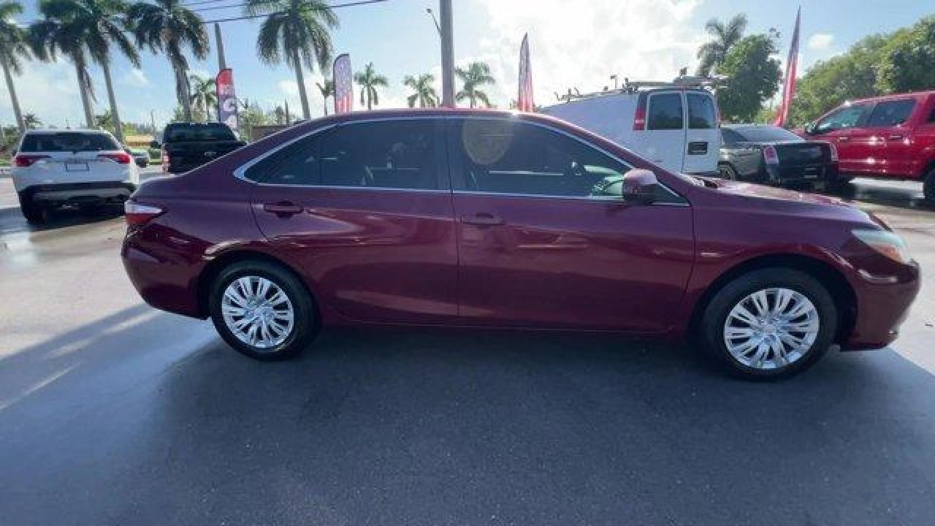 2015 Red Toyota Camry (4T1BF1FK2FU) with an 4 2.5 L engine, Automatic transmission, located at 27610 S Dixie Hwy, Homestead, FL, 33032, (305) 749-2348, 25.510241, -80.438301 - KBB.com 15 Best Family Cars. Delivers 35 Highway MPG and 25 City MPG! This Toyota Camry boasts a Regular Unleaded I-4 2.5 L/152 engine powering this Automatic transmission. Window Grid Antenna, Variable Intermittent Wipers, Valet Function.* This Toyota Camry Features the Following Options *Trunk Rea - Photo#5