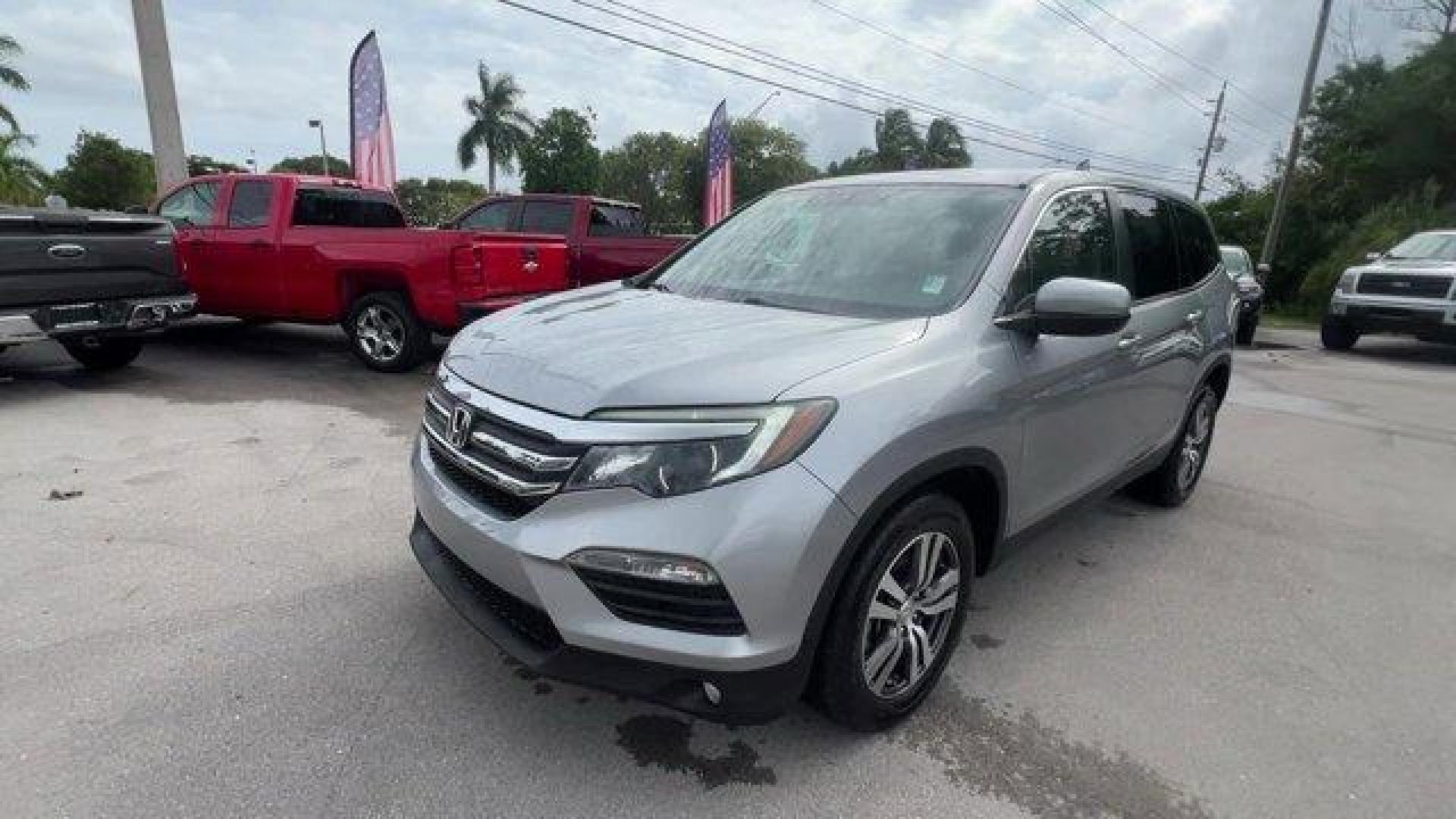 2017 Silver Honda Pilot (5FNYF5H36HB) with an 6 3.5 L engine, Automatic transmission, located at 27610 S Dixie Hwy, Homestead, FL, 33032, (305) 749-2348, 25.510241, -80.438301 - IIHS Top Safety Pick+. Boasts 27 Highway MPG and 19 City MPG! This Honda Pilot delivers a Regular Unleaded V-6 3.5 L/212 engine powering this Automatic transmission. Window Grid Antenna, Wheels: 18 Alloy, Wheels w/Machined Accents.* This Honda Pilot Features the Following Options *VSA Electronic Sta - Photo#0