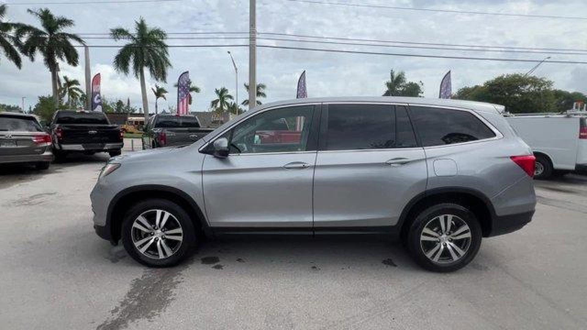 2017 Silver Honda Pilot (5FNYF5H36HB) with an 6 3.5 L engine, Automatic transmission, located at 27610 S Dixie Hwy, Homestead, FL, 33032, (305) 749-2348, 25.510241, -80.438301 - IIHS Top Safety Pick+. Boasts 27 Highway MPG and 19 City MPG! This Honda Pilot delivers a Regular Unleaded V-6 3.5 L/212 engine powering this Automatic transmission. Window Grid Antenna, Wheels: 18 Alloy, Wheels w/Machined Accents.* This Honda Pilot Features the Following Options *VSA Electronic Sta - Photo#1