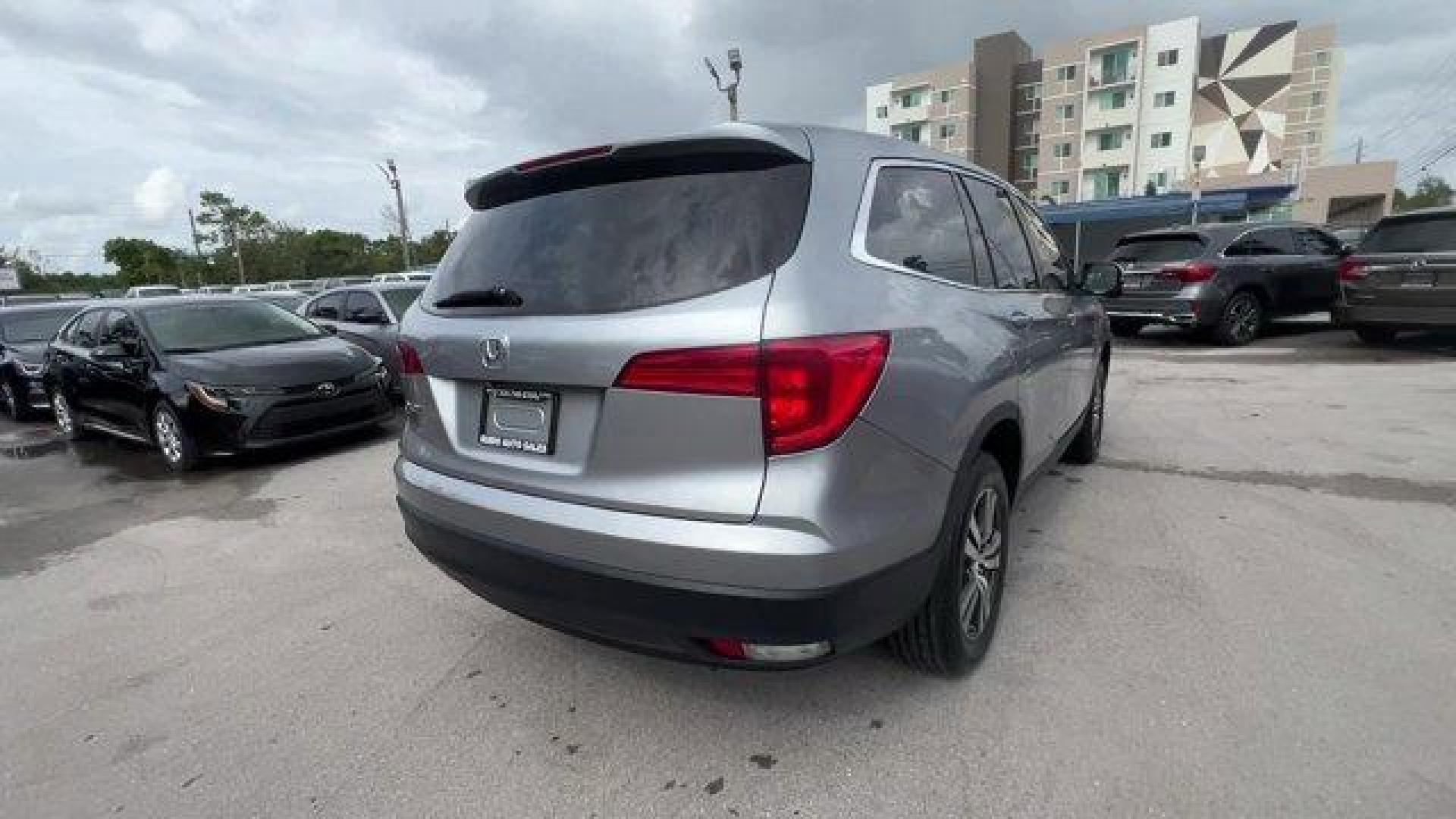 2017 Silver Honda Pilot (5FNYF5H36HB) with an 6 3.5 L engine, Automatic transmission, located at 27610 S Dixie Hwy, Homestead, FL, 33032, (305) 749-2348, 25.510241, -80.438301 - IIHS Top Safety Pick+. Boasts 27 Highway MPG and 19 City MPG! This Honda Pilot delivers a Regular Unleaded V-6 3.5 L/212 engine powering this Automatic transmission. Window Grid Antenna, Wheels: 18 Alloy, Wheels w/Machined Accents.* This Honda Pilot Features the Following Options *VSA Electronic Sta - Photo#4