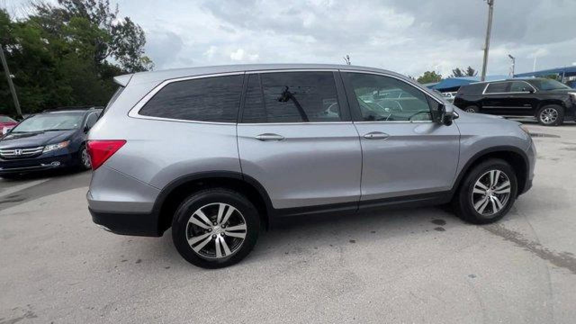 2017 Silver Honda Pilot (5FNYF5H36HB) with an 6 3.5 L engine, Automatic transmission, located at 27610 S Dixie Hwy, Homestead, FL, 33032, (305) 749-2348, 25.510241, -80.438301 - IIHS Top Safety Pick+. Boasts 27 Highway MPG and 19 City MPG! This Honda Pilot delivers a Regular Unleaded V-6 3.5 L/212 engine powering this Automatic transmission. Window Grid Antenna, Wheels: 18 Alloy, Wheels w/Machined Accents.* This Honda Pilot Features the Following Options *VSA Electronic Sta - Photo#5