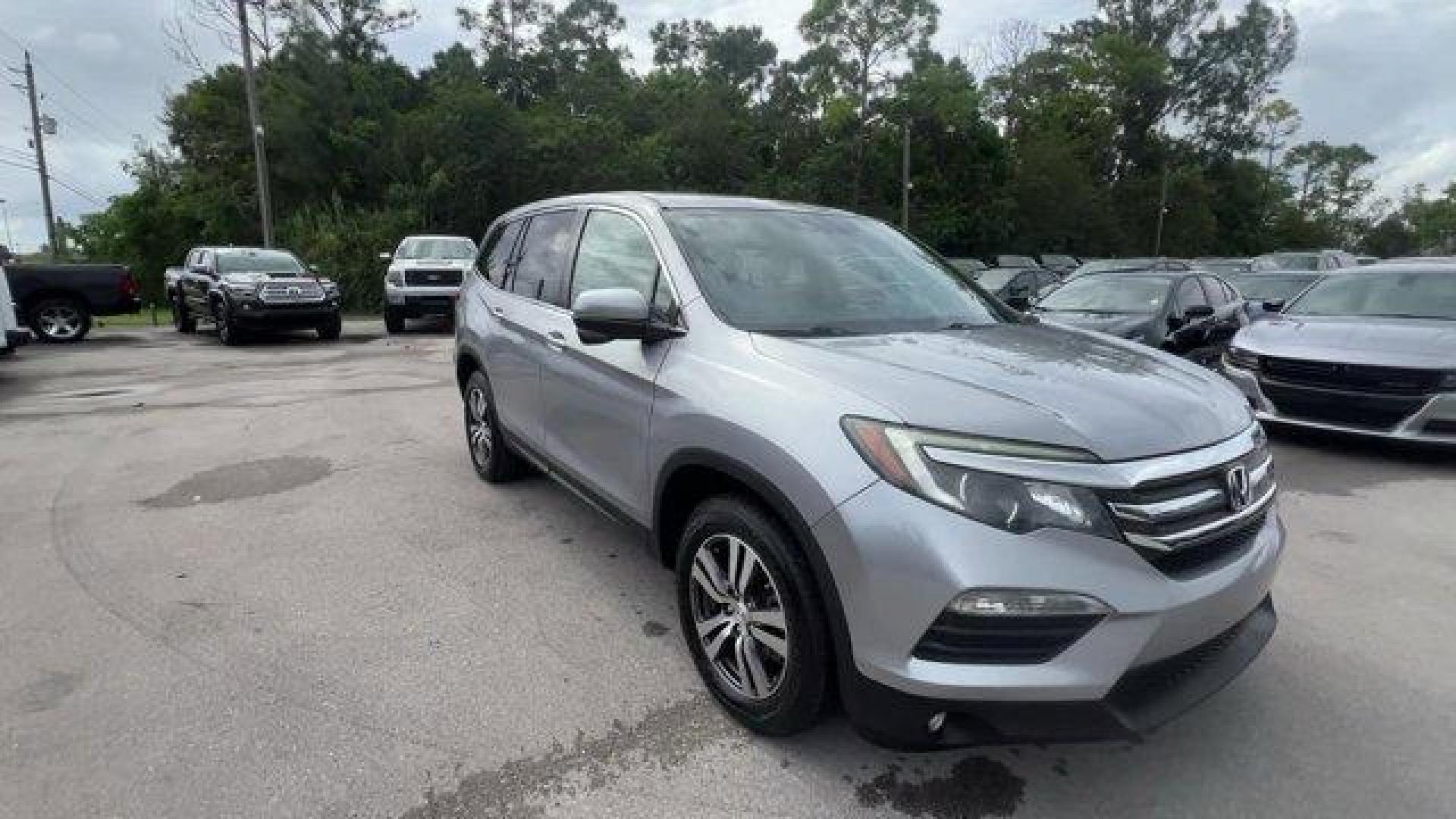 2017 Silver Honda Pilot (5FNYF5H36HB) with an 6 3.5 L engine, Automatic transmission, located at 27610 S Dixie Hwy, Homestead, FL, 33032, (305) 749-2348, 25.510241, -80.438301 - IIHS Top Safety Pick+. Boasts 27 Highway MPG and 19 City MPG! This Honda Pilot delivers a Regular Unleaded V-6 3.5 L/212 engine powering this Automatic transmission. Window Grid Antenna, Wheels: 18 Alloy, Wheels w/Machined Accents.* This Honda Pilot Features the Following Options *VSA Electronic Sta - Photo#6