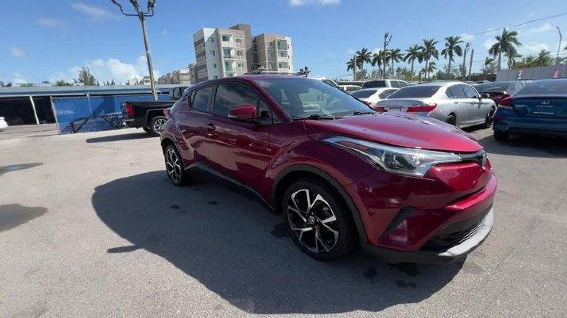 2019 Maroon Toyota C-HR (JTNKHMBX7K1) with an 4 2.0 L engine, Variable transmission, located at 27610 S Dixie Hwy, Homestead, FL, 33032, (305) 749-2348, 25.510241, -80.438301 - KBB.com Best Resale Value Awards. Delivers 31 Highway MPG and 27 City MPG! This Toyota C-HR delivers a Regular Unleaded I-4 2.0 L/121 engine powering this Variable transmission. Wing Spoiler, VSC Electronic Stability Control (ESC), Variable Intermittent Wipers.*This Toyota C-HR Comes Equipped with T - Photo#5