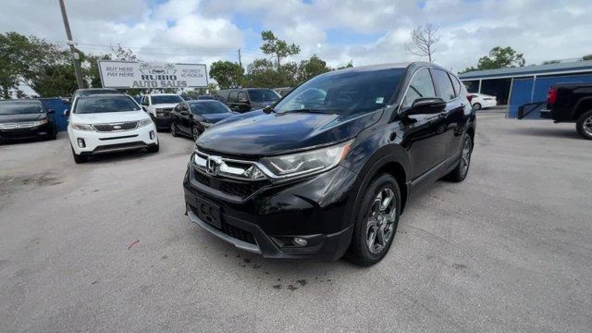 2017 Black Honda CR-V (2HKRW2H51HH) with an 4 1.5 L engine, Variable transmission, located at 27610 S Dixie Hwy, Homestead, FL, 33032, (305) 749-2348, 25.510241, -80.438301 - KBB.com 10 Most Awarded Brands. Scores 33 Highway MPG and 27 City MPG! This Honda CR-V boasts a Intercooled Turbo Regular Unleaded I-4 1.5 L/91 engine powering this Variable transmission. Wheels: 18 Alloy, Valet Function, Urethane Gear Shifter Material.* This Honda CR-V Features the Following Option - Photo#0